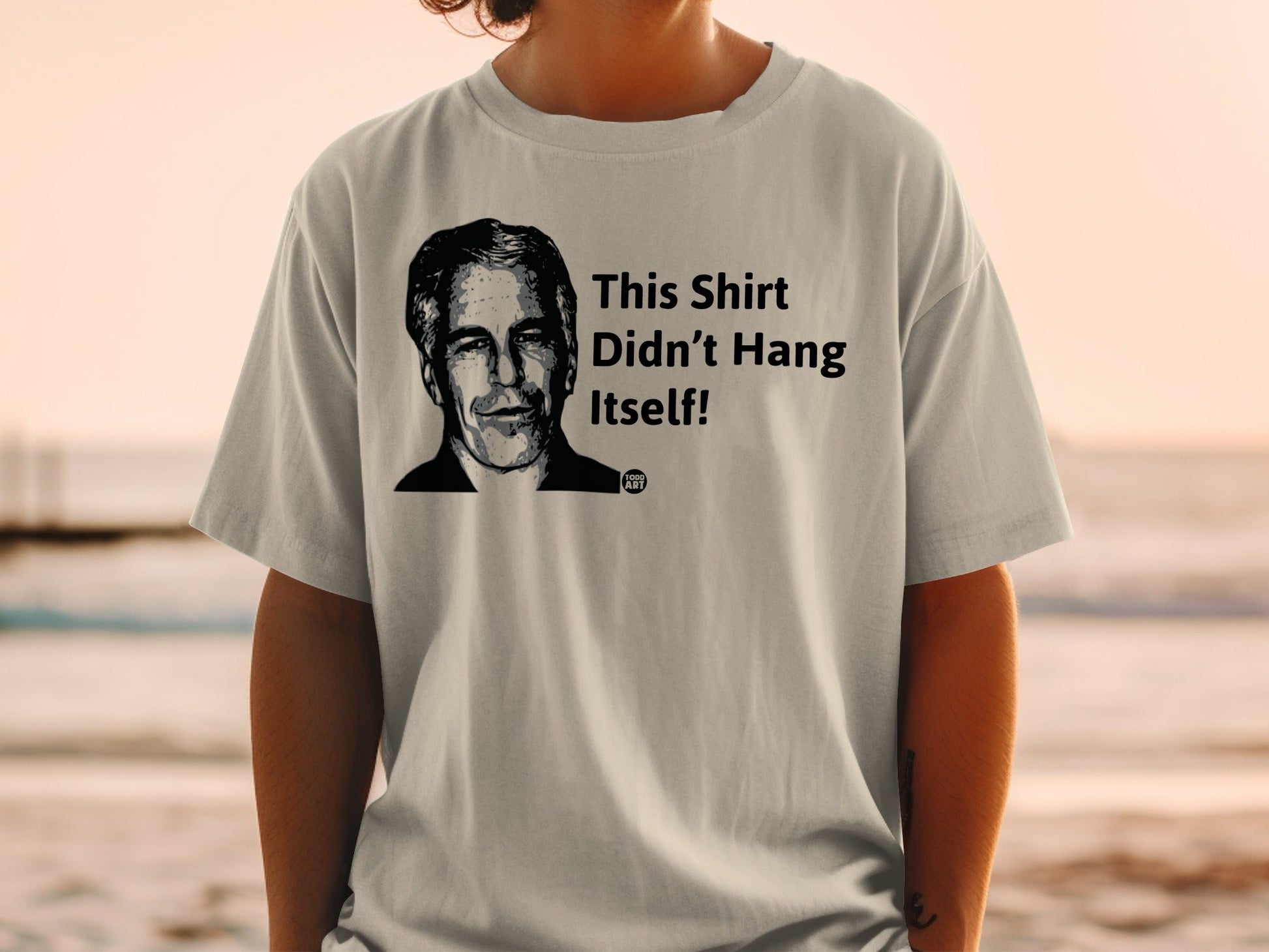 T-shirt with black and white portrait and text "This Shirt Didn't Hang Itself!"