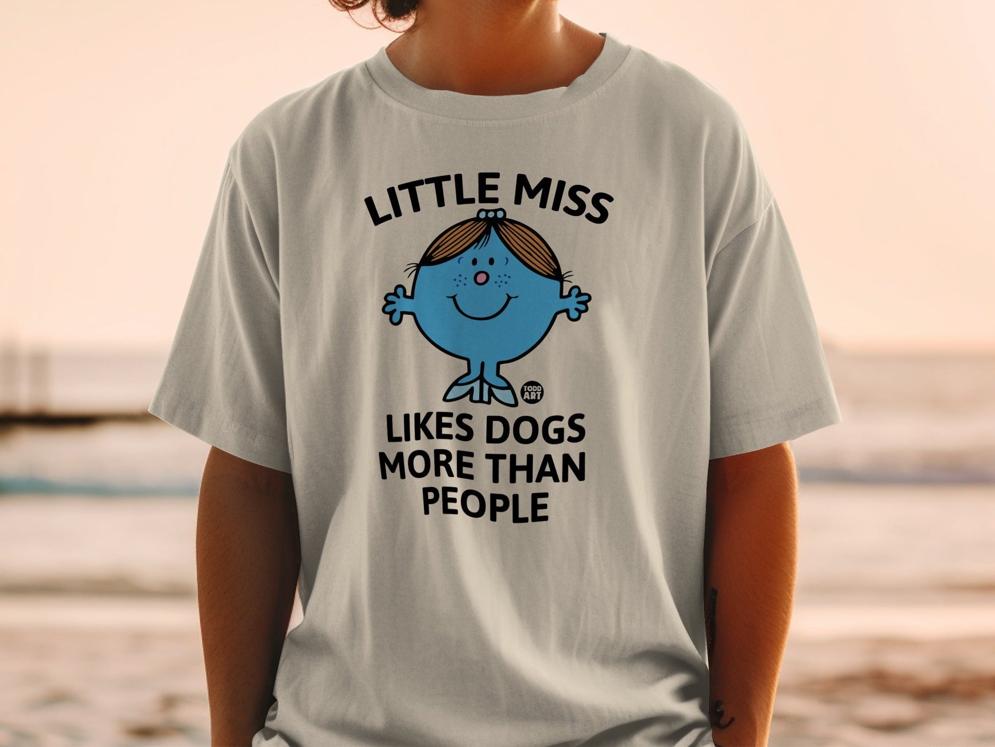 Little Miss character with text "Loves Dogs More Than People".