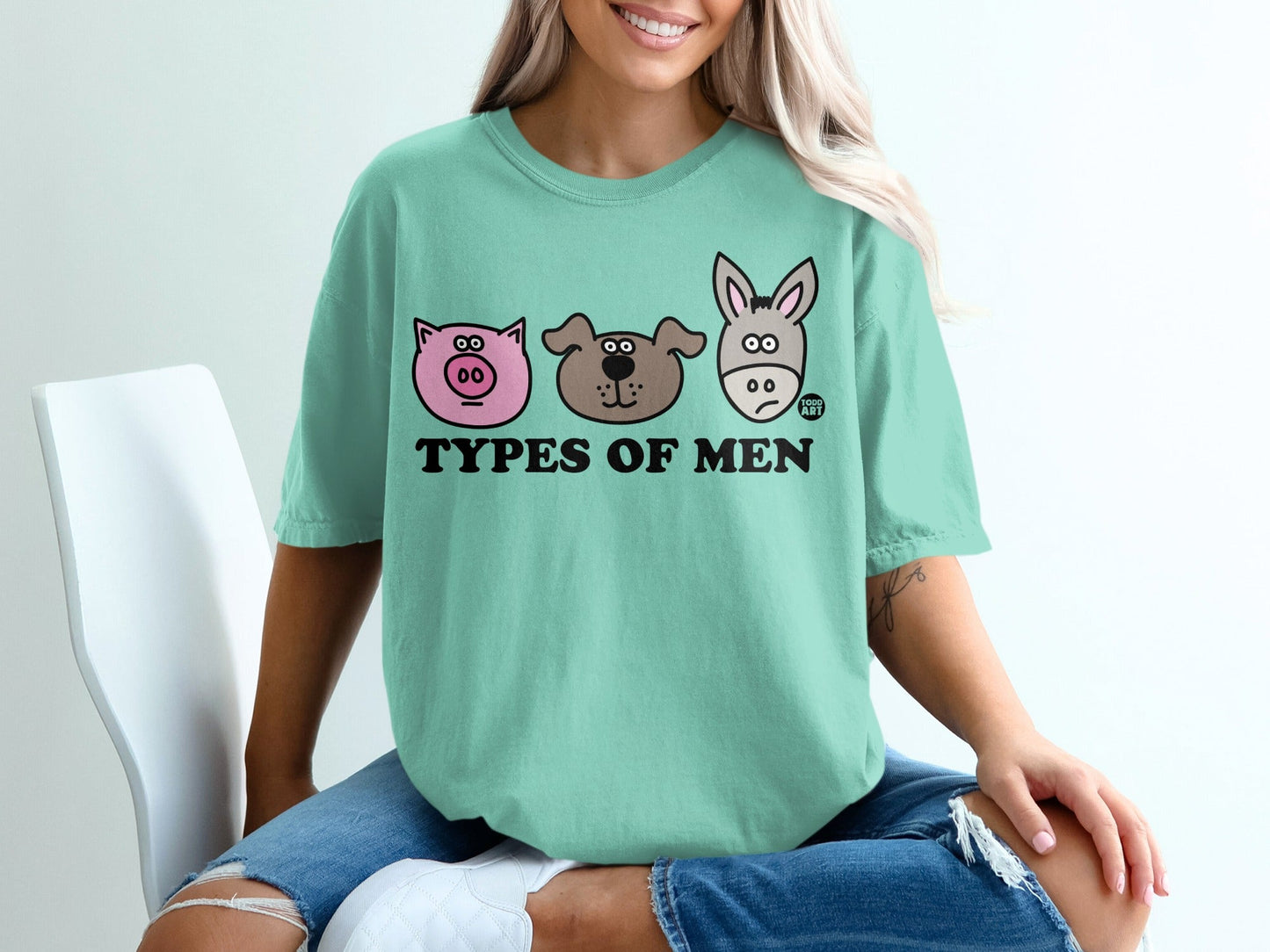 T-shirt with cartoon pig, dog, and donkey faces and "TYPES OF MEN" text.