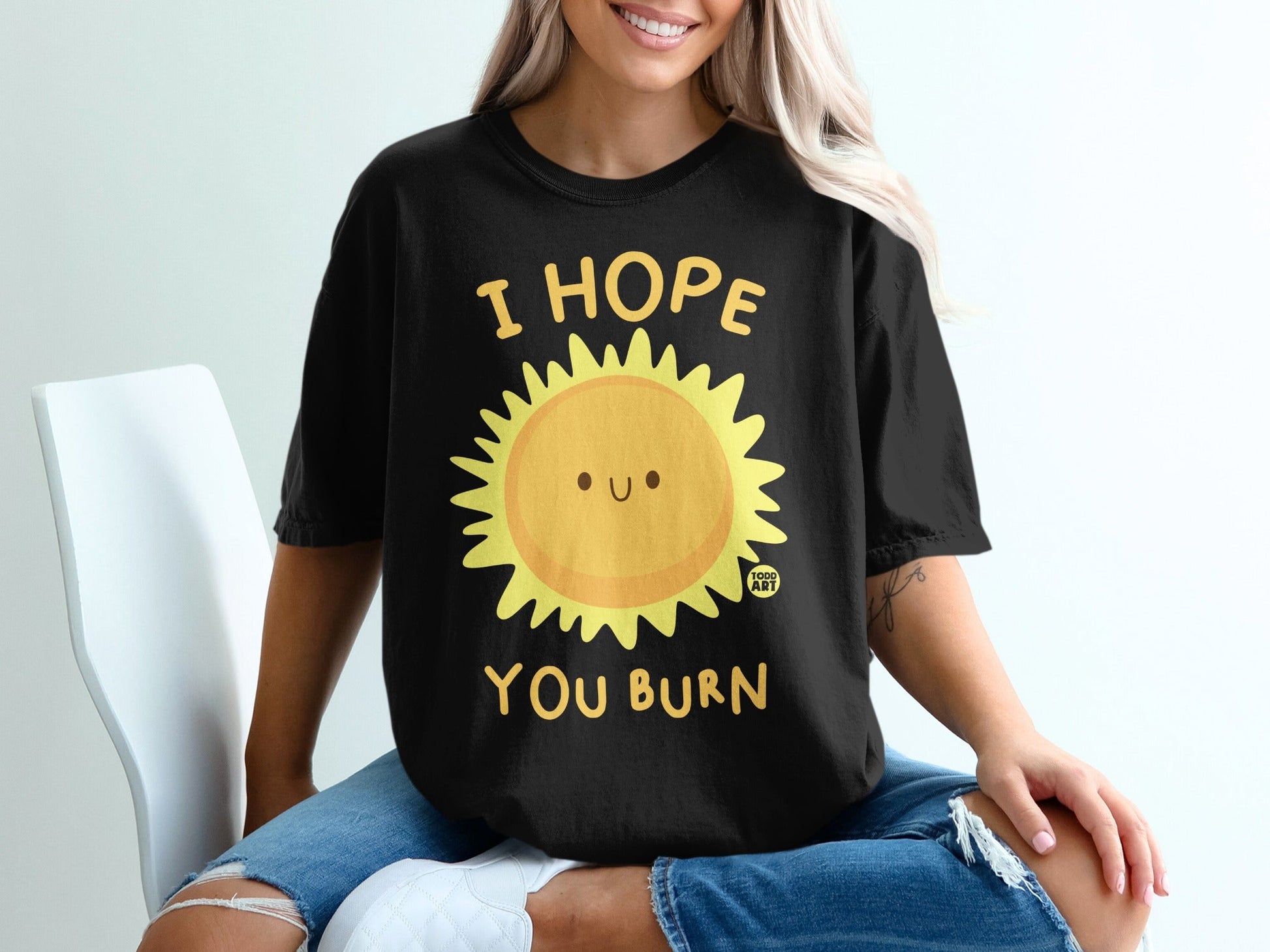 Black t-shirt with smiling sun graphic and text "I HOPE YOU BURN".