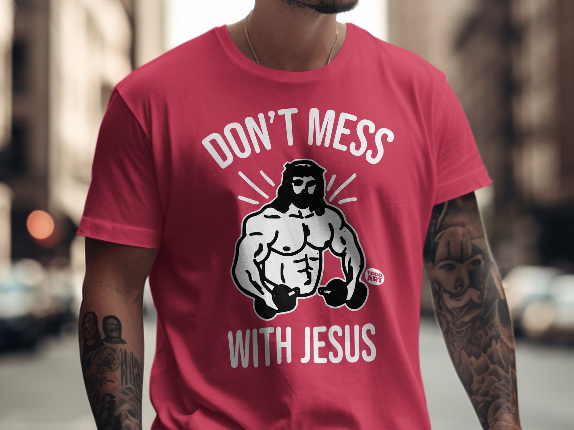 Red t-shirt with "Don't Mess With Jesus" and muscular Jesus graphic.