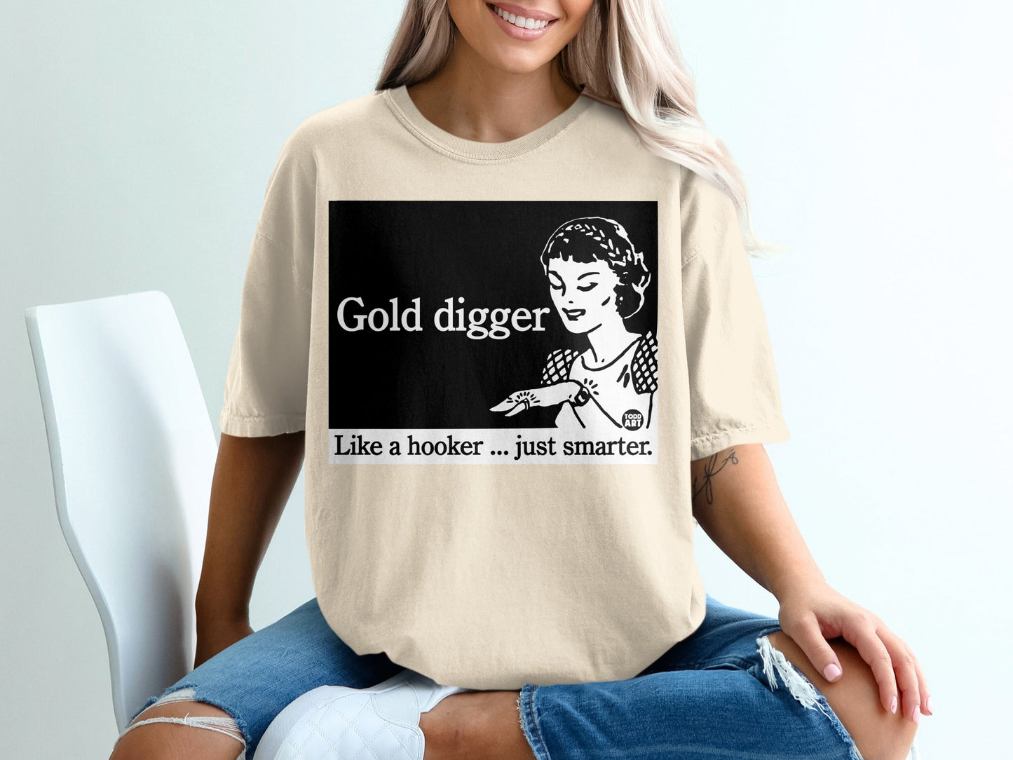Cream t-shirt with "Gold Digger. Like a hooker...just smarter." text and graphic.