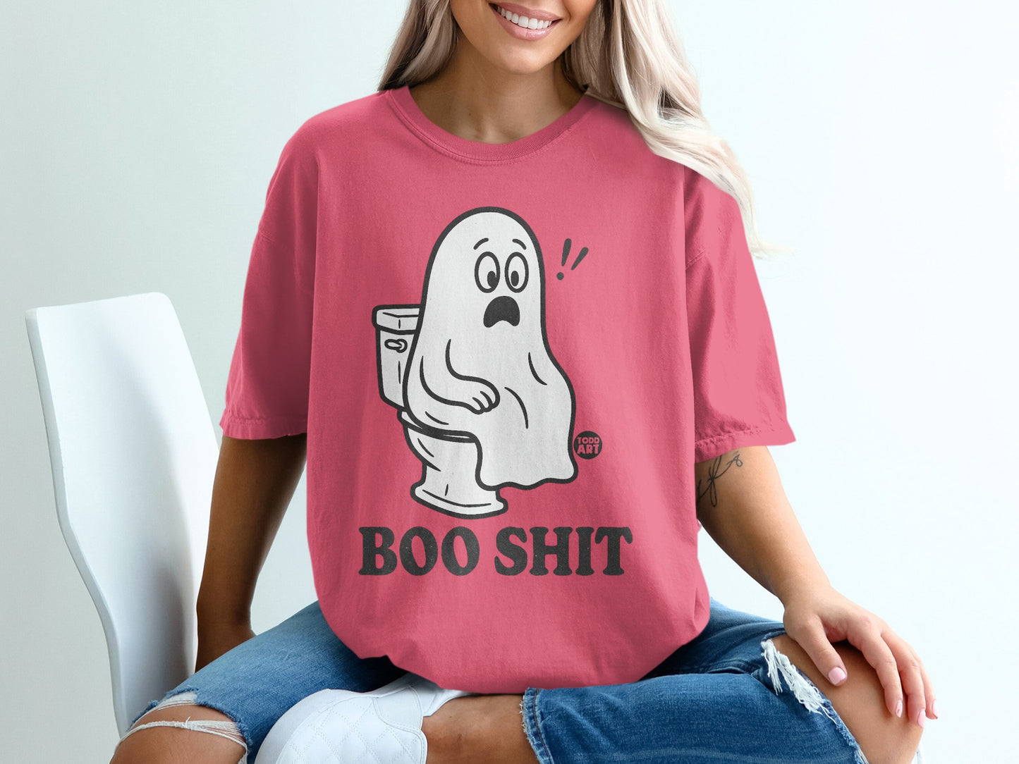 Pink t-shirt with a ghost sitting on a toilet, text reads "BOO SHIT".