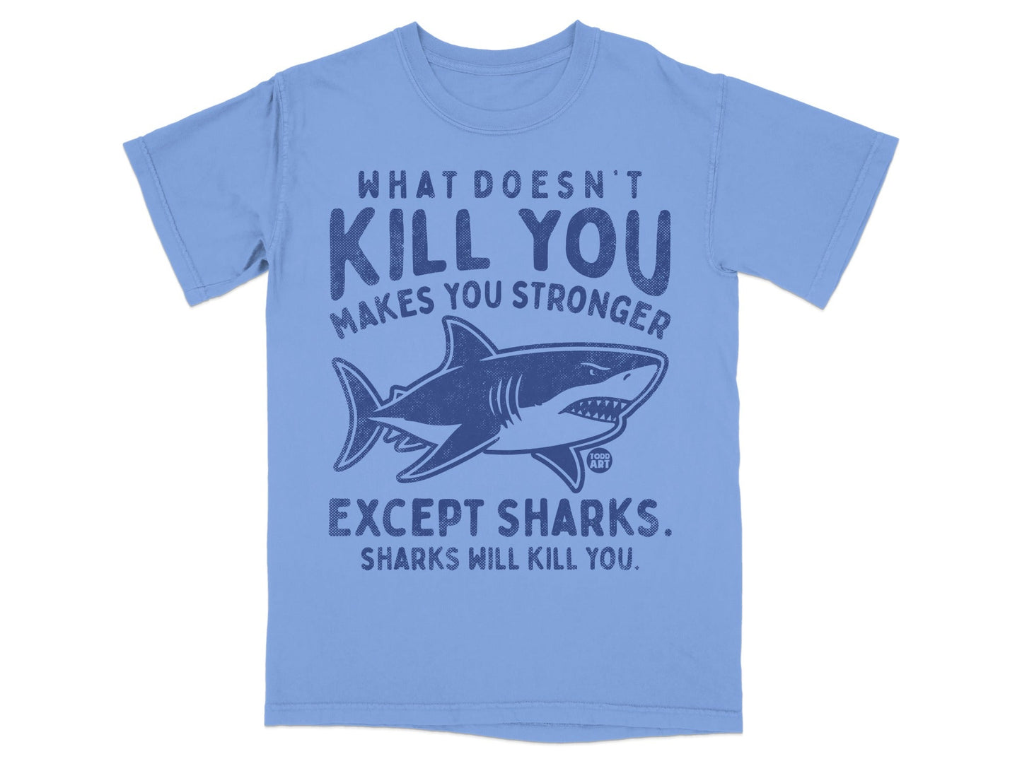 Blue t-shirt with shark graphic and text "What doesn't kill you makes you stronger except sharks."