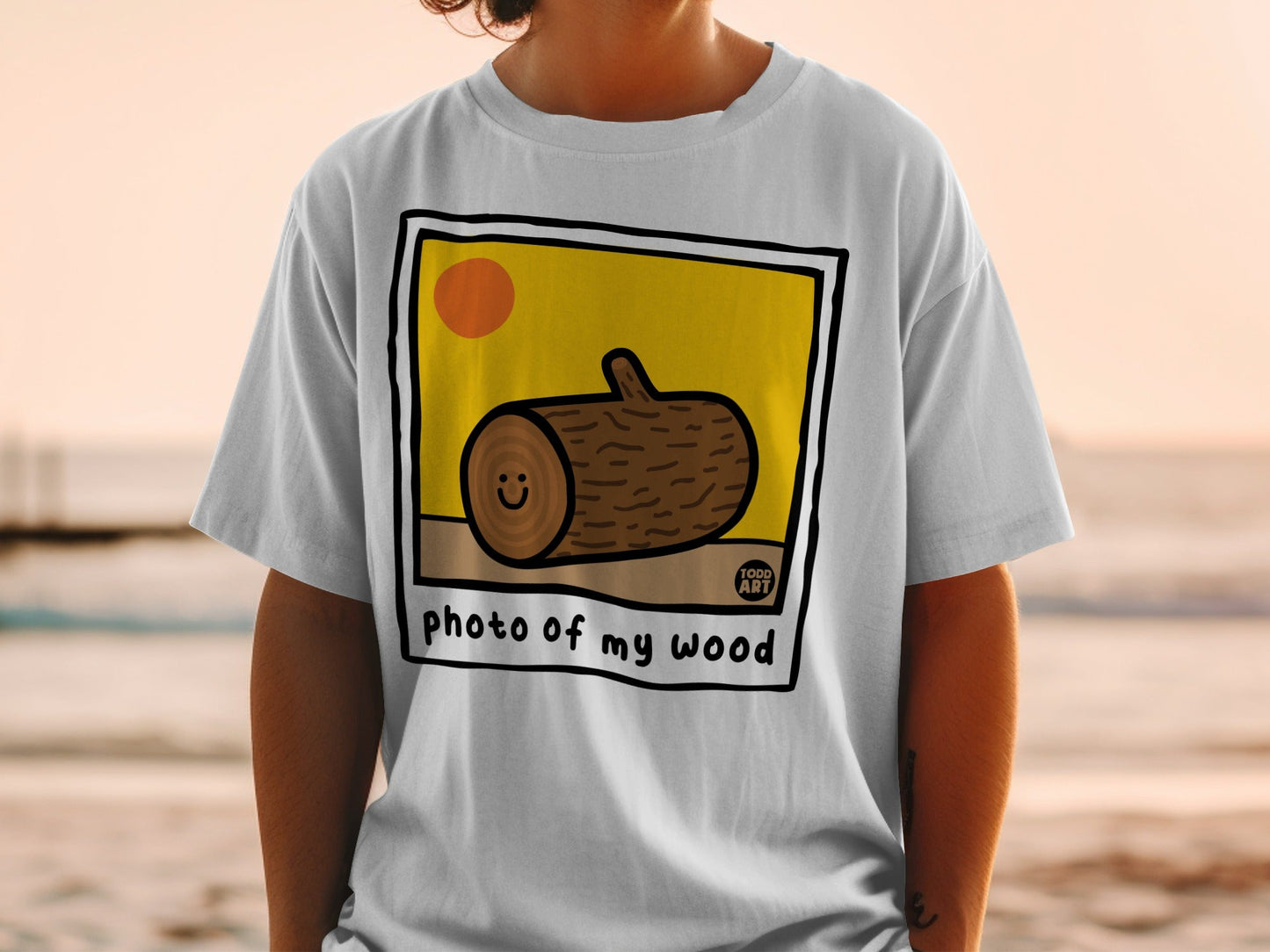 T-shirt featuring a cartoon wood log with a smiling face and "photo of my wood" text.