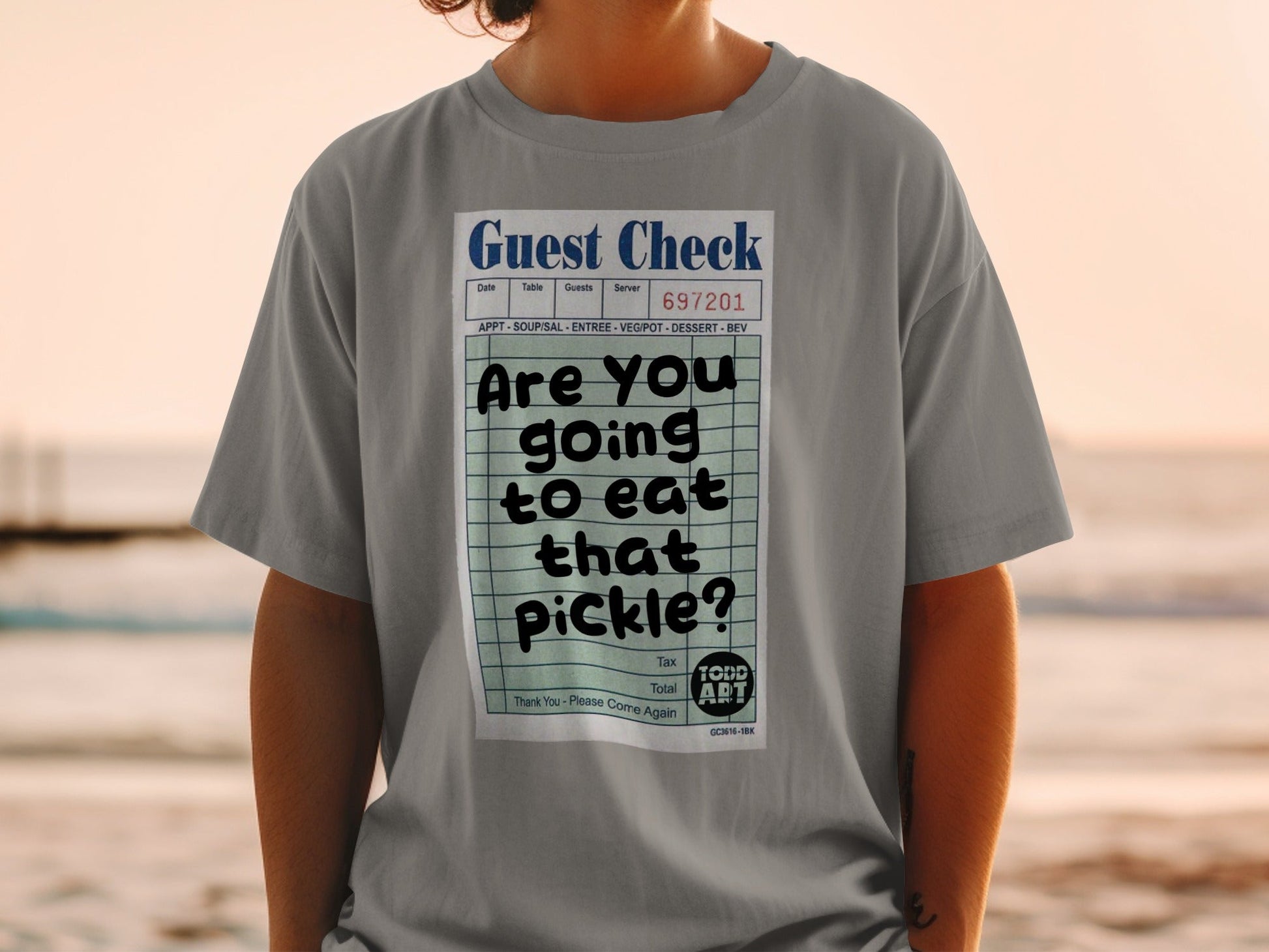 T-shirt with a graphic of a guest check asking "Are you going to eat that pickle?".