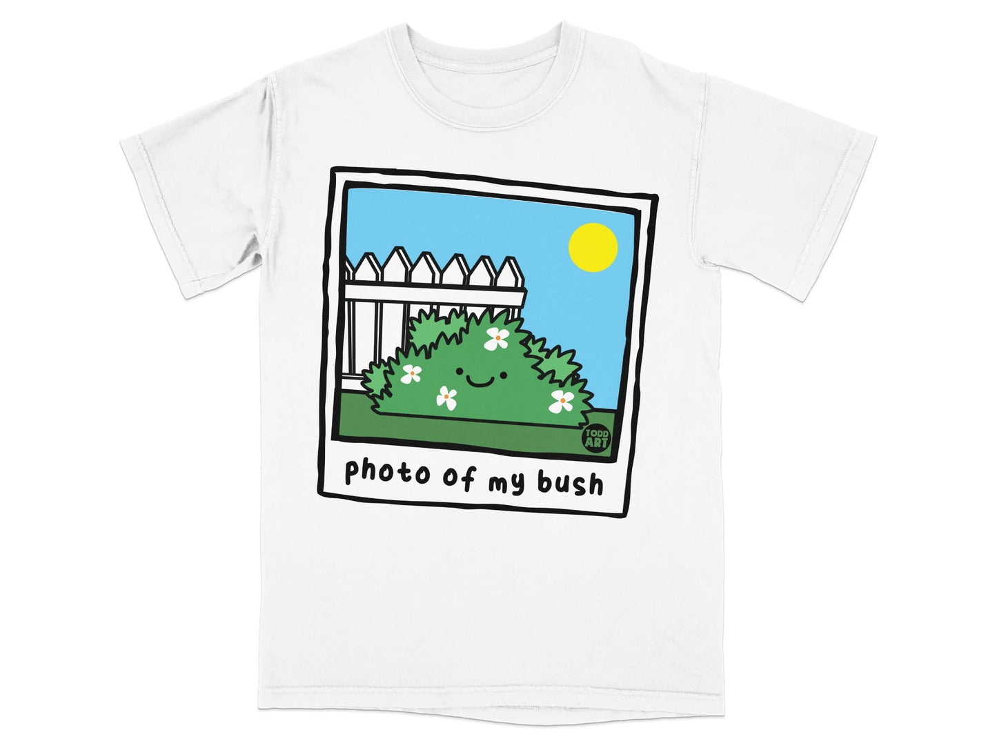White t-shirt with a polaroid image of a smiling bush with flowers, fence, and sun.