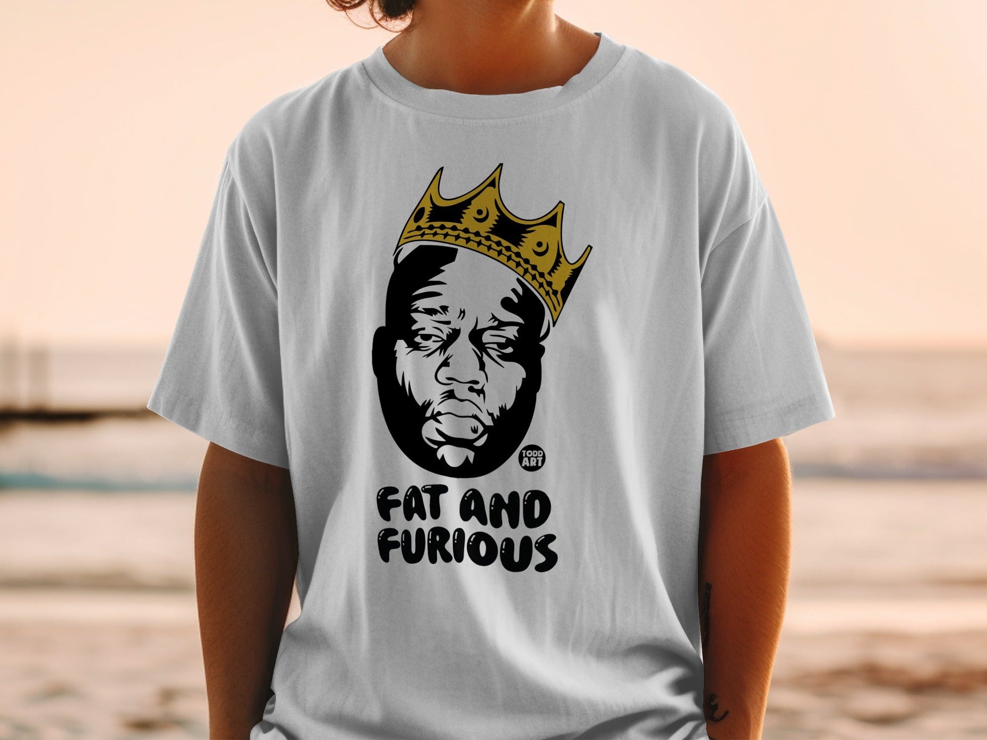 White t-shirt with Biggie Smalls graphic wearing a crown and text "FAT AND FURIOUS".