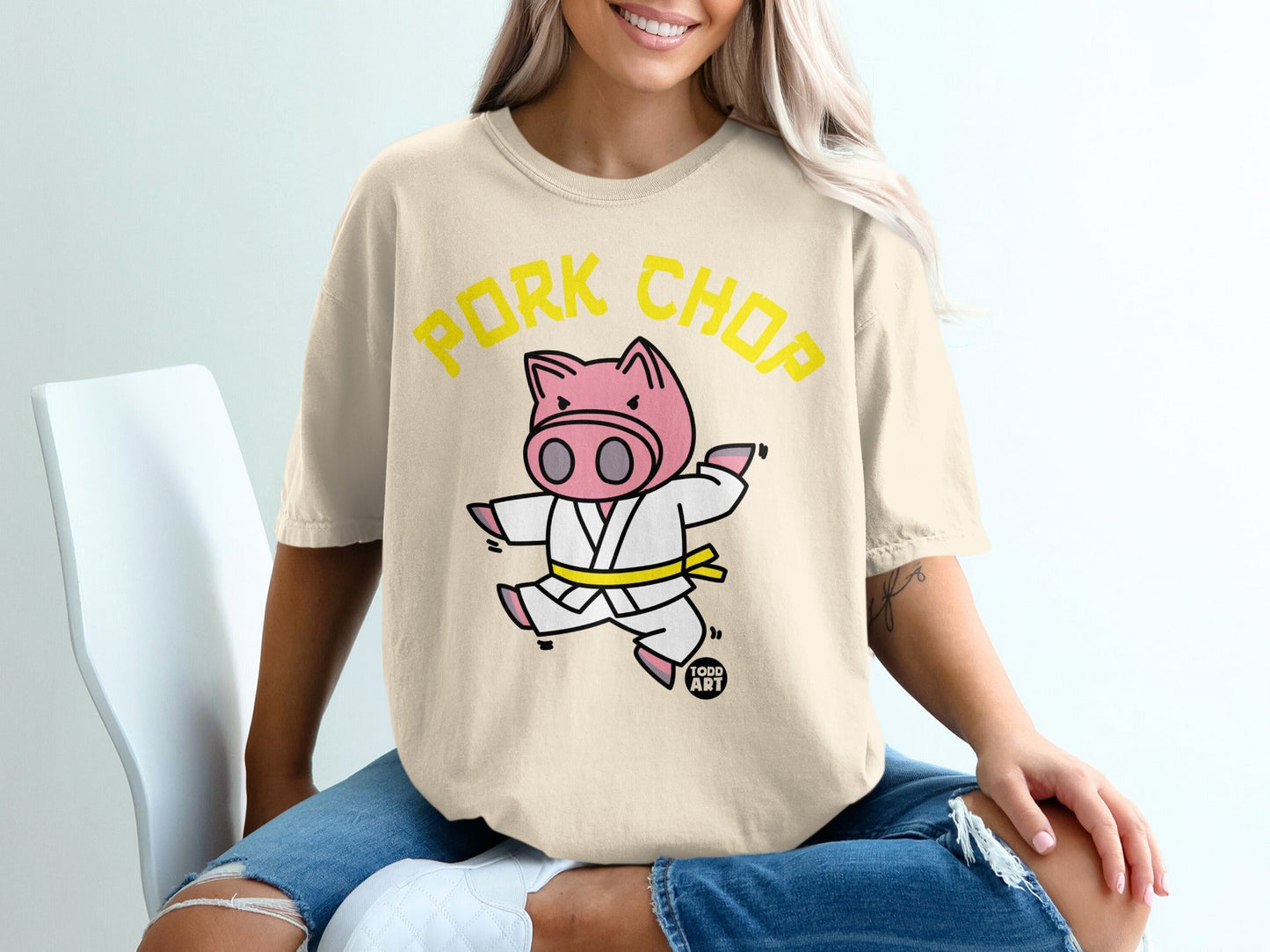 T-shirt featuring a cartoon pig in a karate gi with text "Pork Chop".