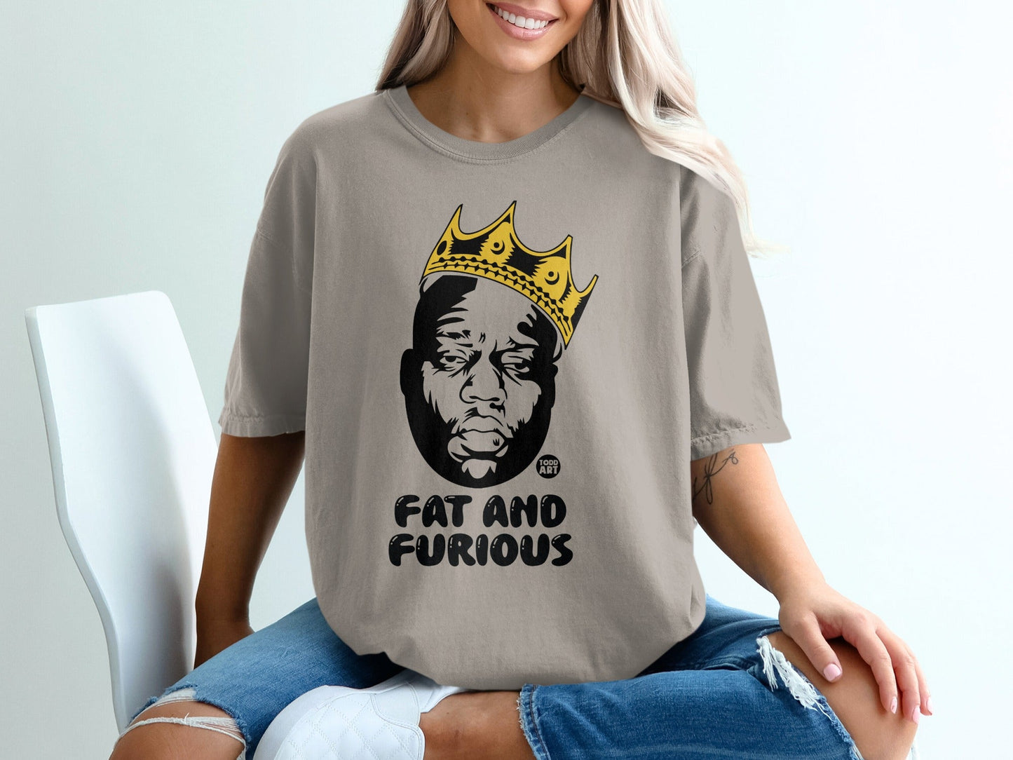 T-shirt with "Fat and Furious" text and a portrait of a man wearing a crown.
