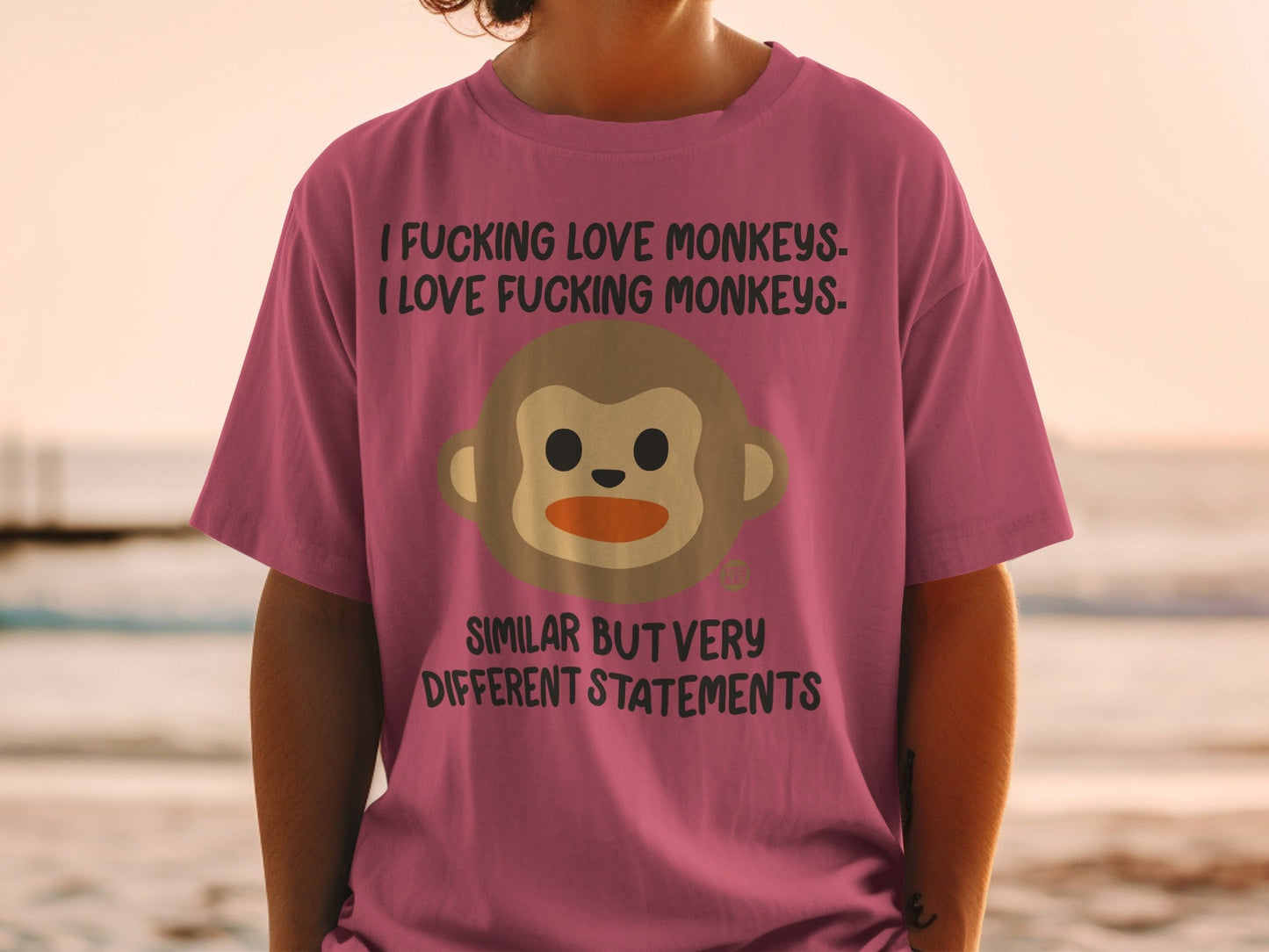 Pink t-shirt with "I Fucking Love Monkeys. I Love Fucking Monkeys. Similar But Very Different Statements" and monkey graphic.