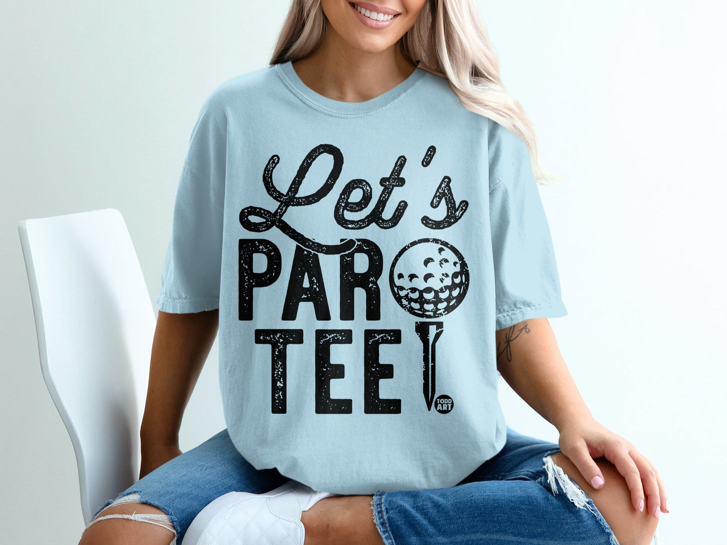 Light blue t-shirt with "Let's Par-Tee" text and golf ball graphic.