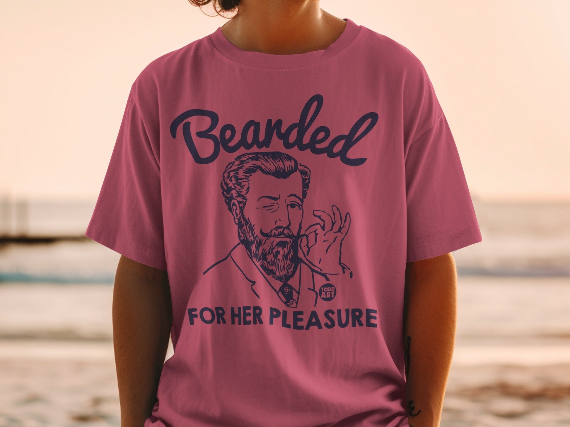 T-shirt with a drawing of a man and text "Bearded for her pleasure".