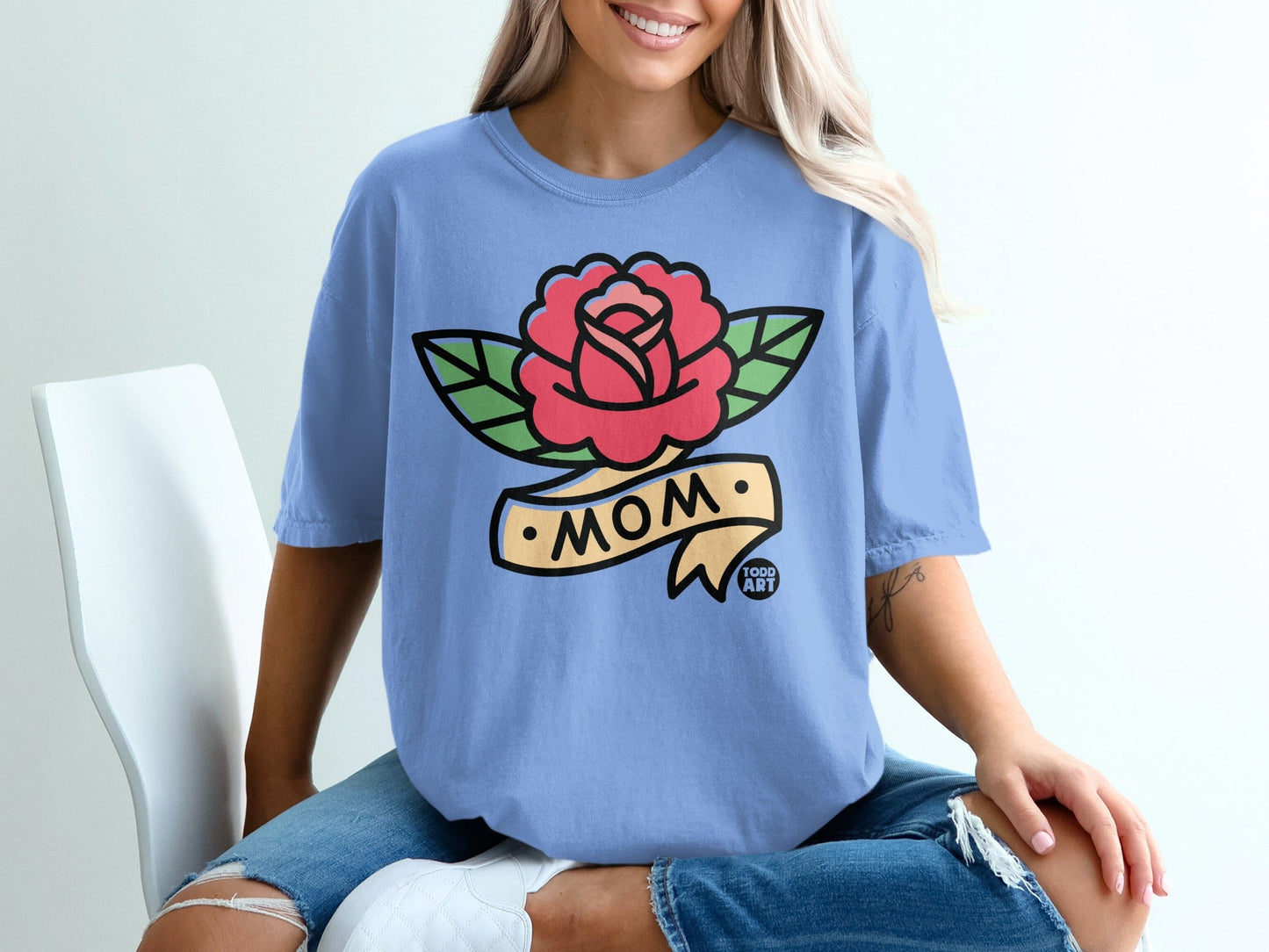 Blue t-shirt with red rose and "MOM" banner design.
