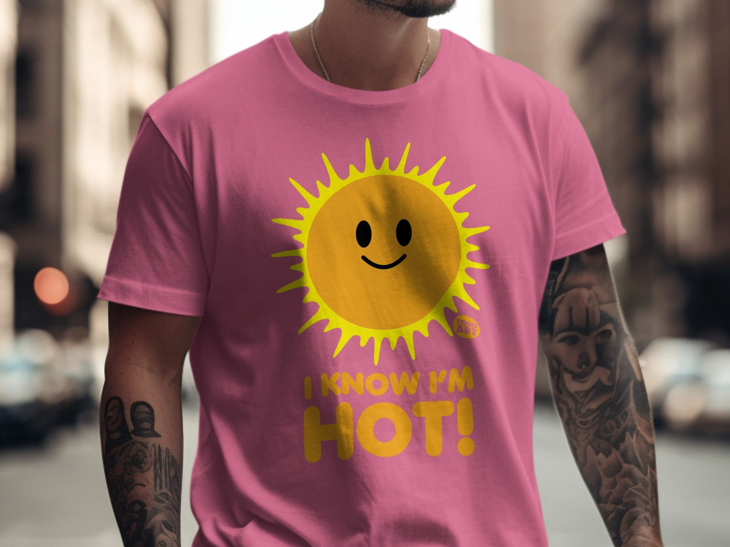 Pink t-shirt with a smiling sun graphic and the text "I KNOW I'M HOT!".