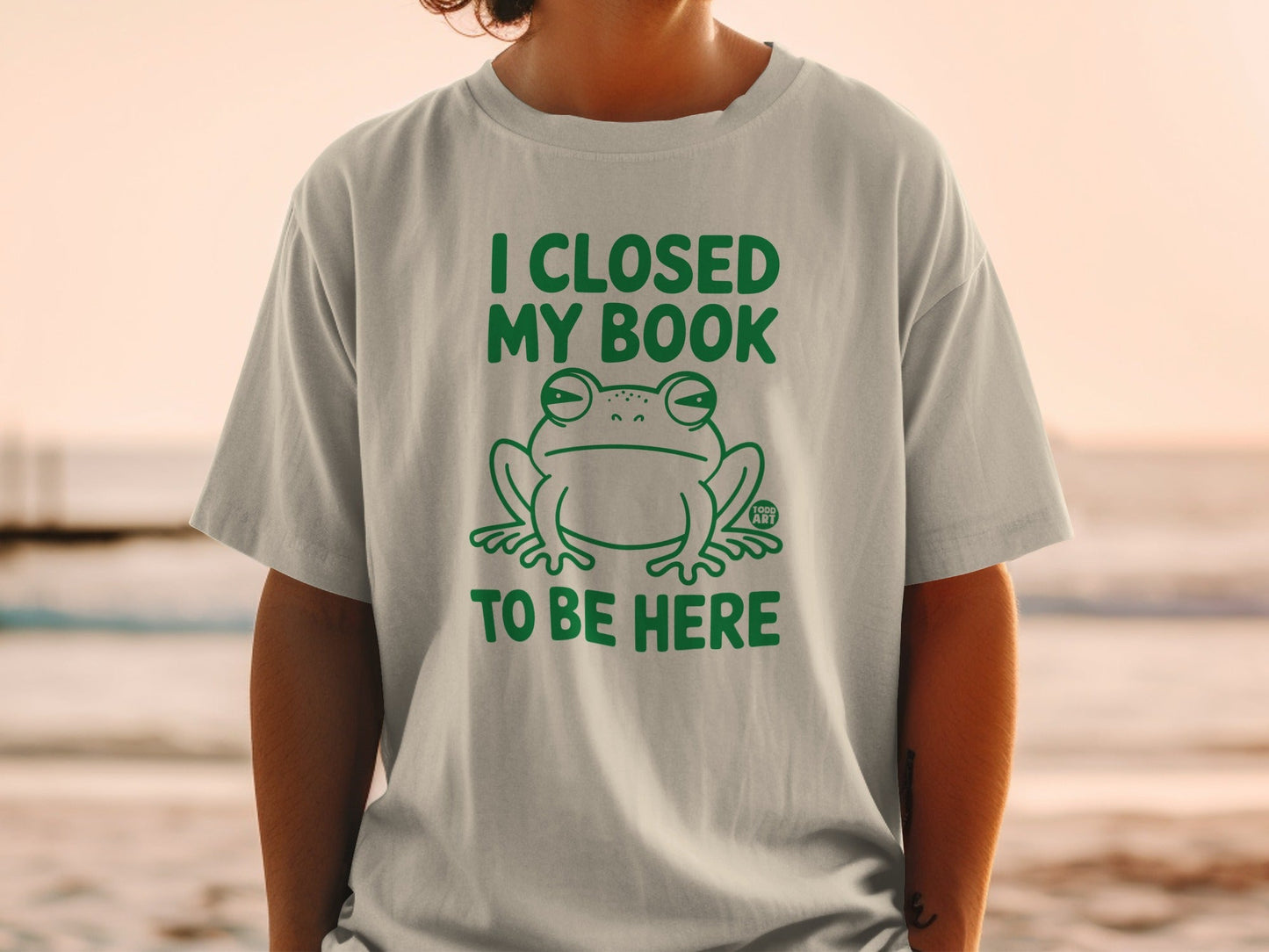 I Closed My Book To Be Here Frog Graphic T-shirt