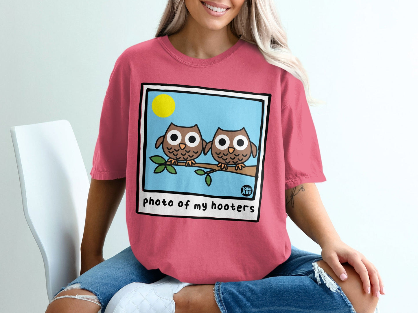 Two cartoon owls perched on a branch with text "photo of my hooters."
