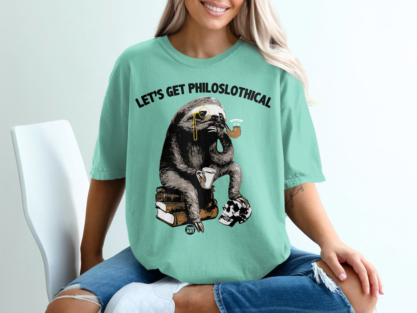 Sloth wearing monocle and smoking pipe, sitting on books with skull.