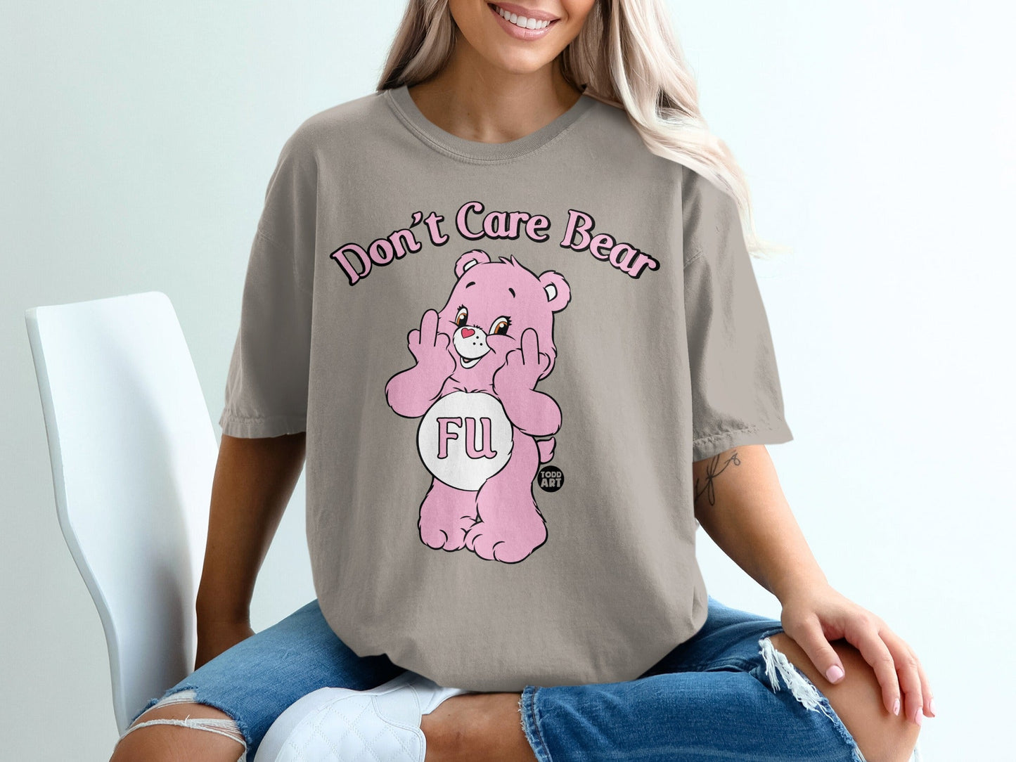 Pink Care Bear character with "FU" on stomach, giving middle fingers.