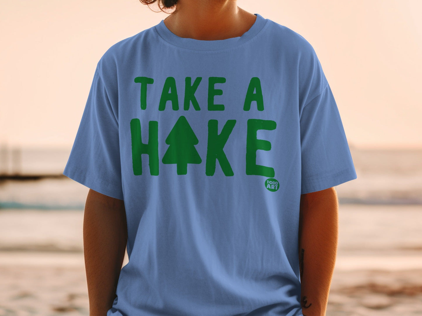 Blue t-shirt with "TAKE A HIKE" and a green tree logo.