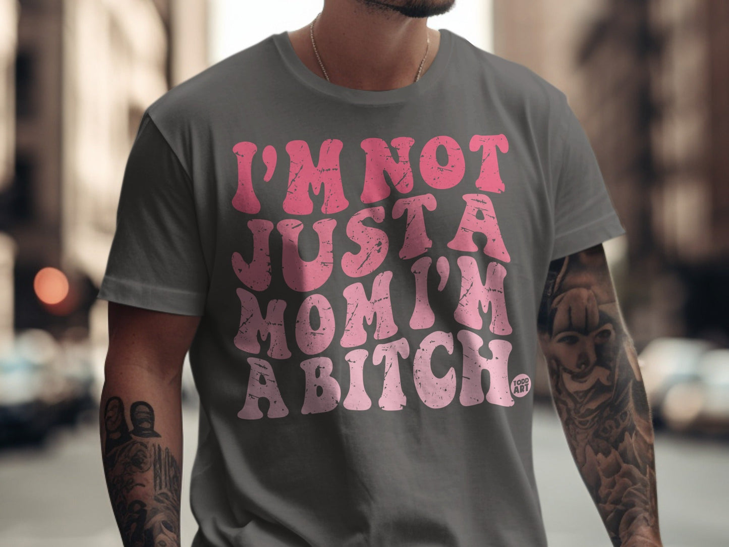 Grey t-shirt with pink text: "I'M NOT JUST A MOM I'M A BITCH."