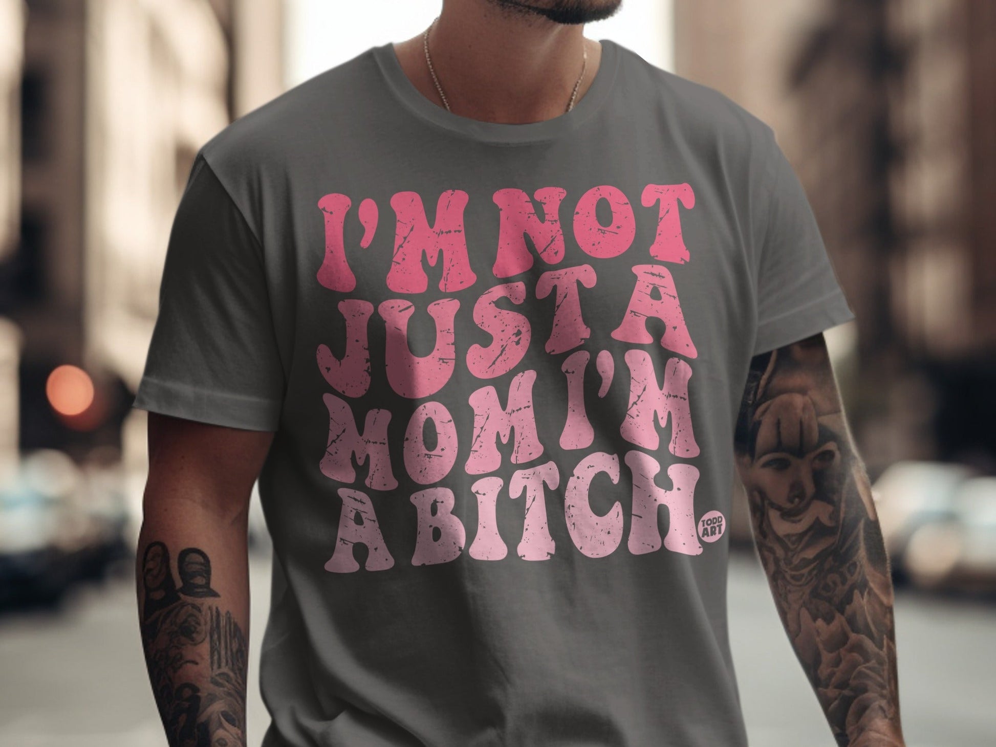 Grey t-shirt with pink text: "I'M NOT JUST A MOM I'M A BITCH."