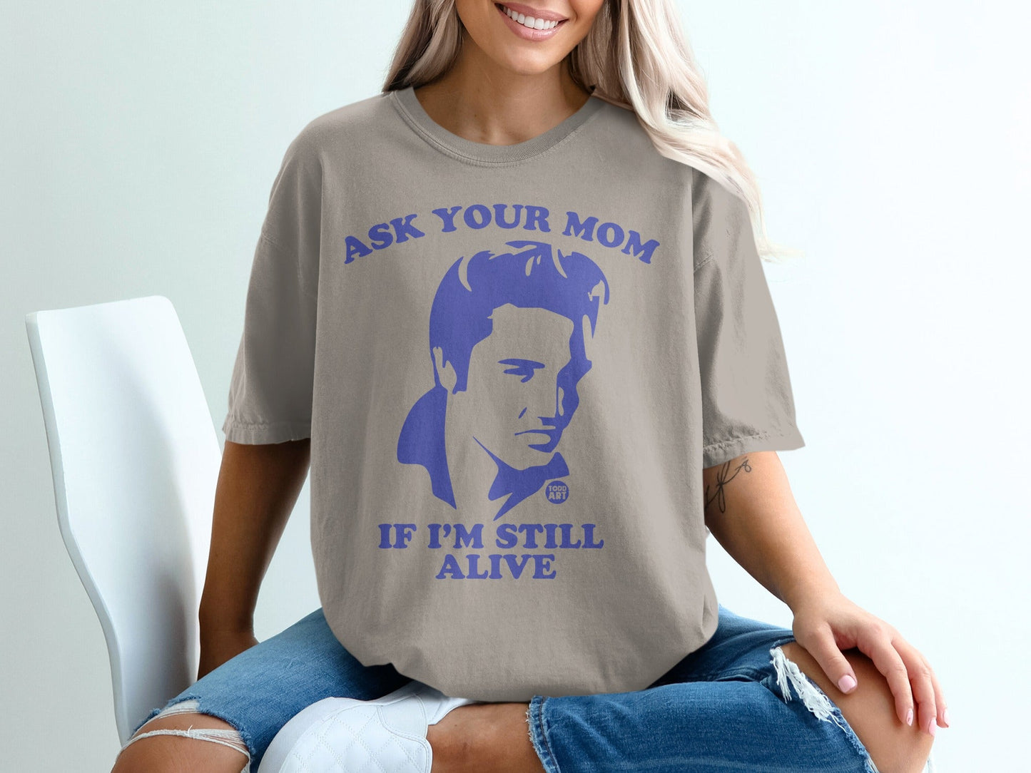 T-shirt with Elvis Presley graphic and text "ASK YOUR MOM IF I'M STILL ALIVE".