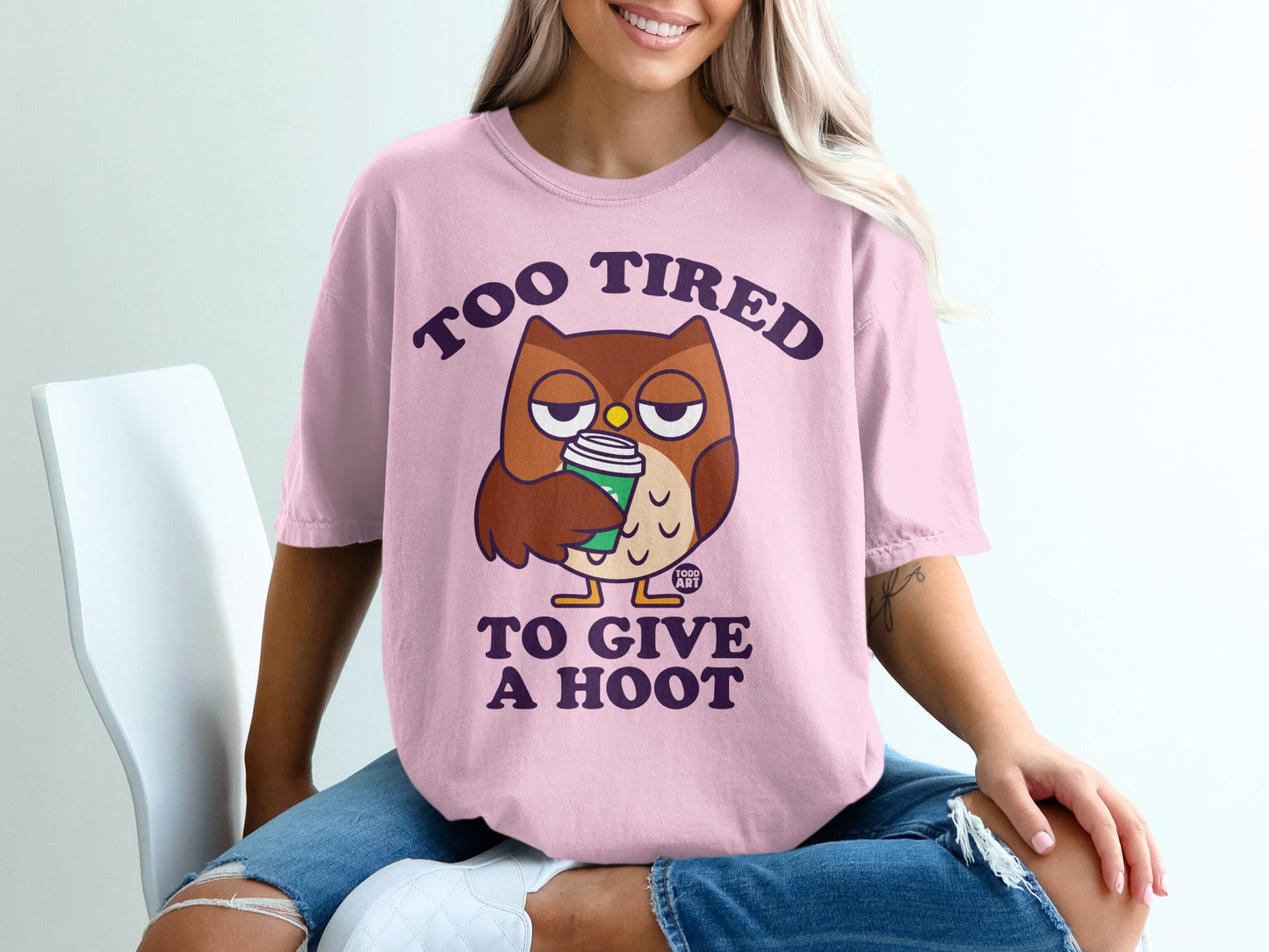 Pink t-shirt with owl graphic and text "TOO TIRED TO GIVE A HOOT".
