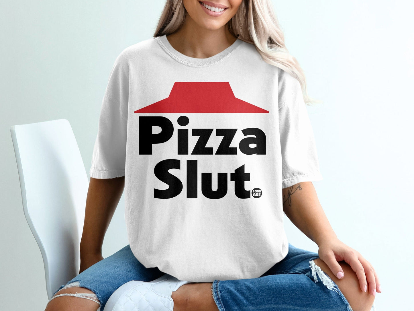 White t-shirt with black "Pizza Slut" text and red roof logo.
