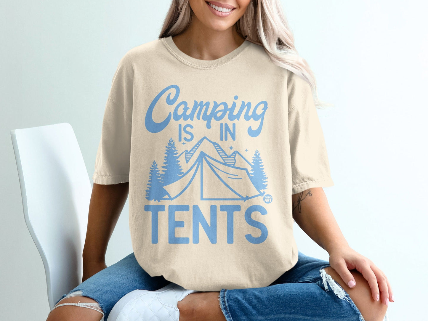 Cream t-shirt with "Camping is in Tents" text and tent graphic.