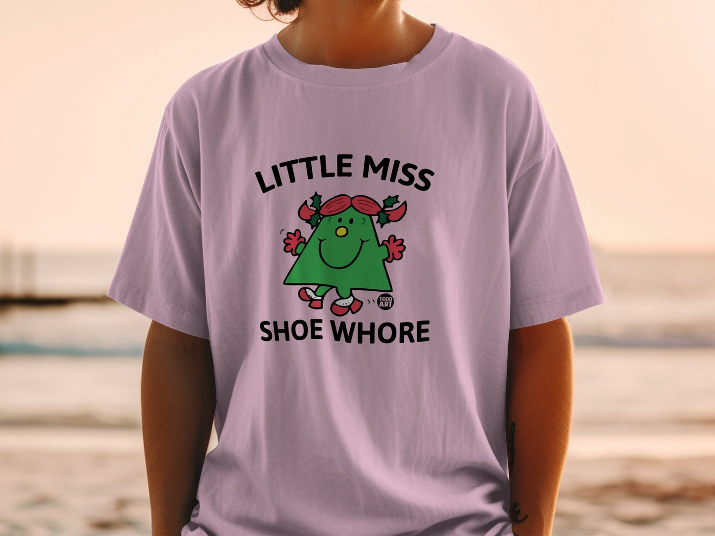 Little Miss Shoe Whore graphic tee with a cartoon character.