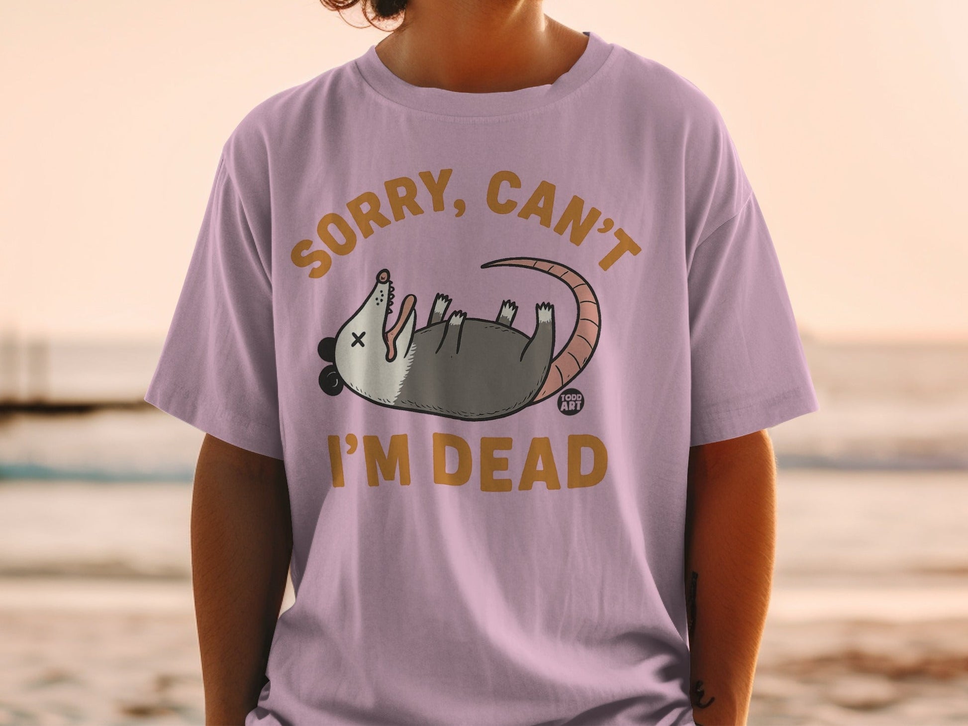 Opossum lying on its back with text "Sorry, can't I'm dead."