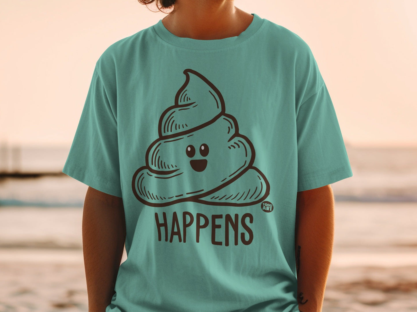 Teal t-shirt with a smiling poop emoji and "HAPPENS" text.