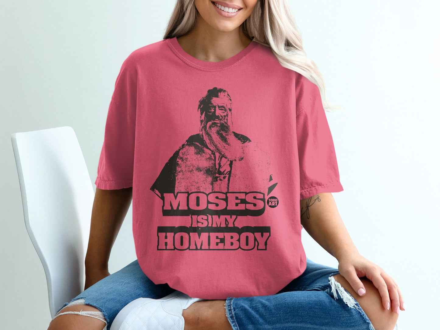 Pink t-shirt with graphic "Moses is my homeboy" and portrait of Moses.