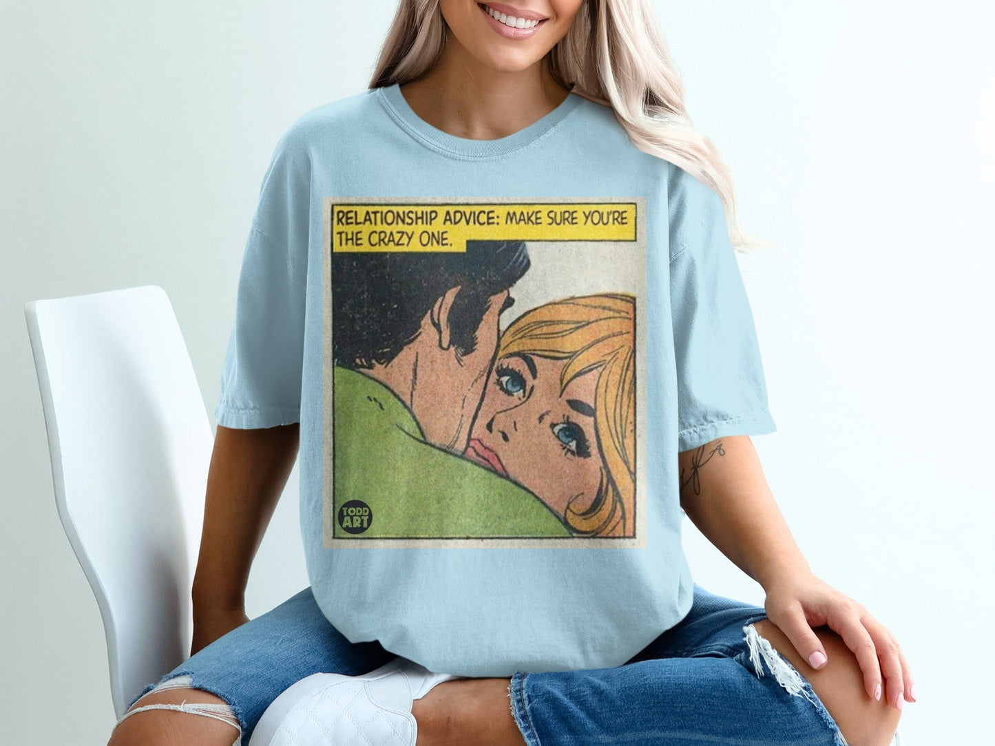 Light blue t-shirt with comic art reading "RELATIONSHIP ADVICE: MAKE SURE YOU'RE THE CRAZY ONE."