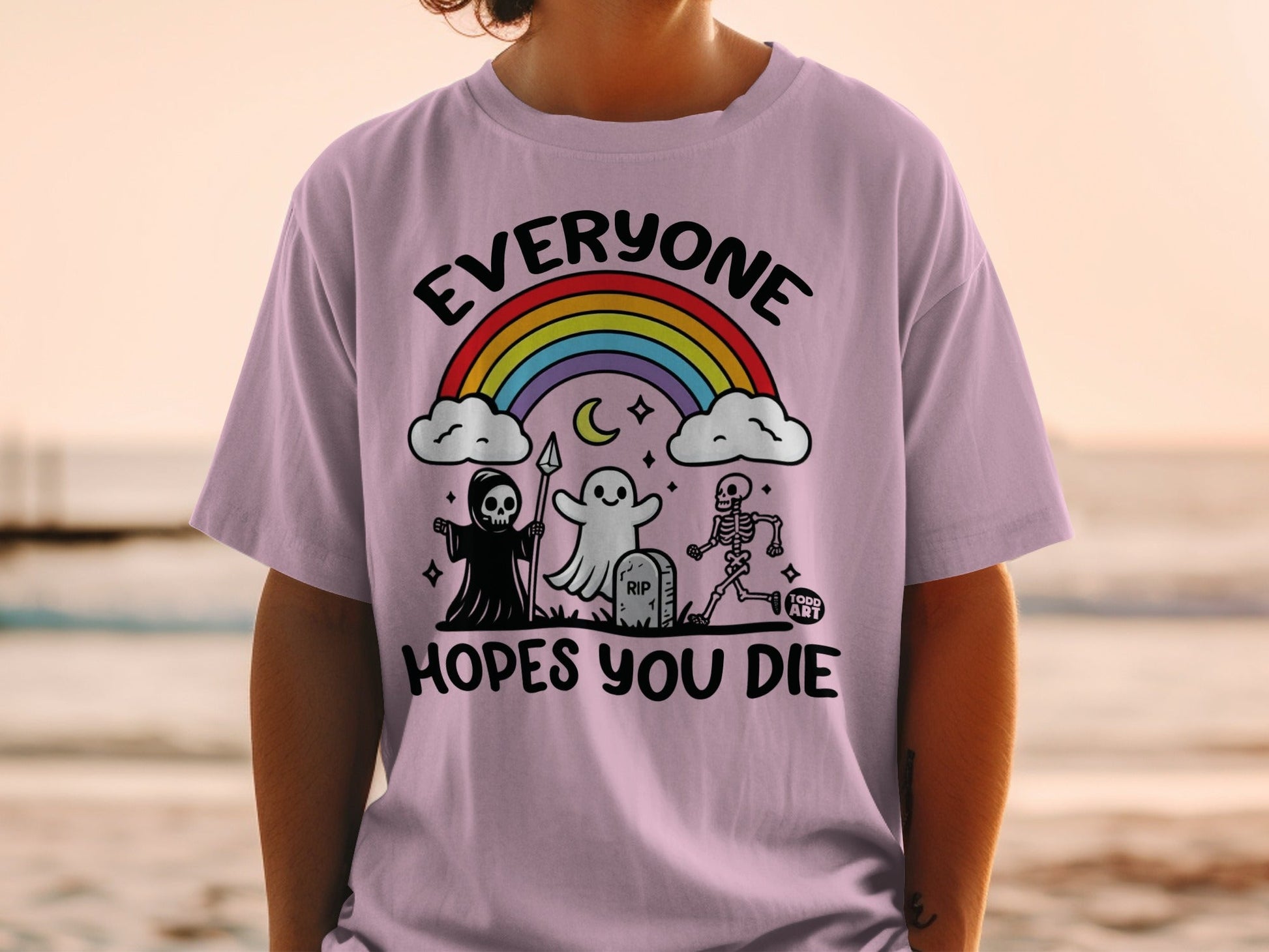 Purple t-shirt with "Everyone Hopes You Die" and Halloween graphics.