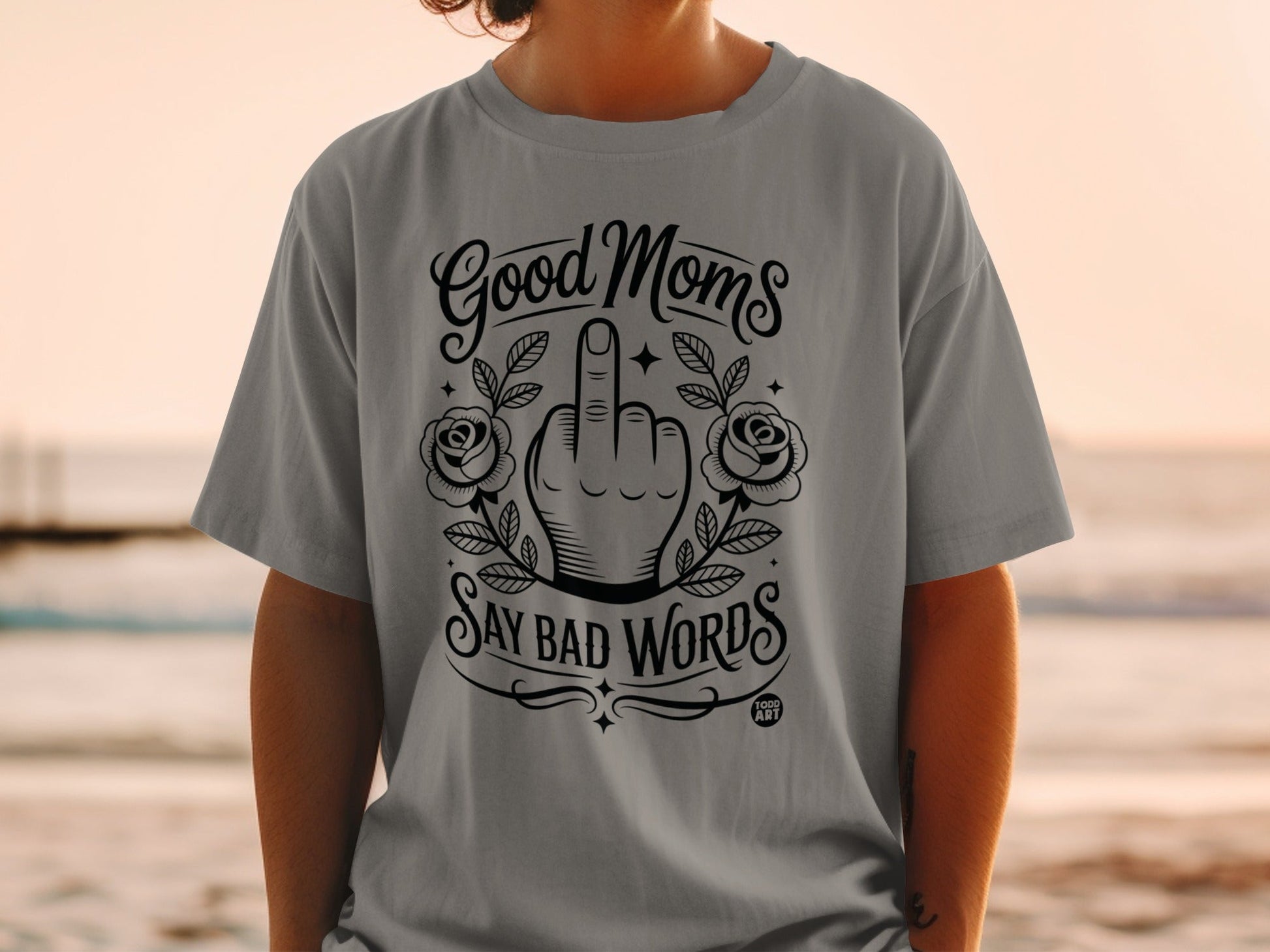 Gray t-shirt with "Good Moms Say Bad Words" and middle finger graphic.
