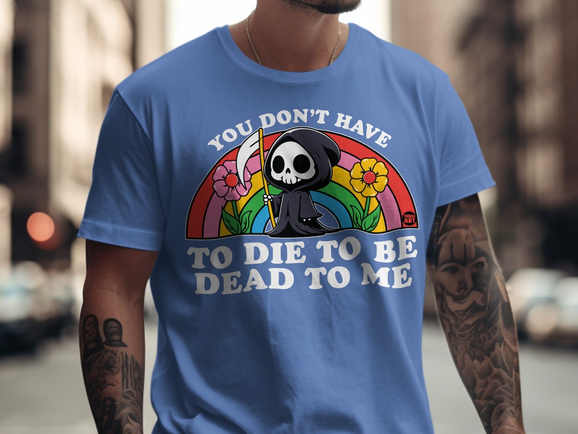 Blue t-shirt with Grim Reaper character and "You don't have to die to be dead to me" text.