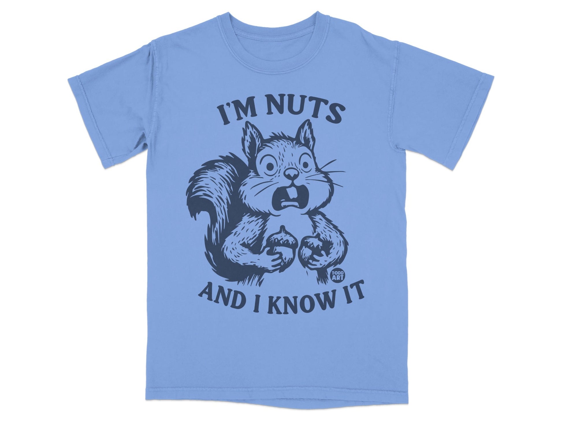 Light blue t-shirt with a startled squirrel holding acorns and text that reads "I'm nuts and I know it".