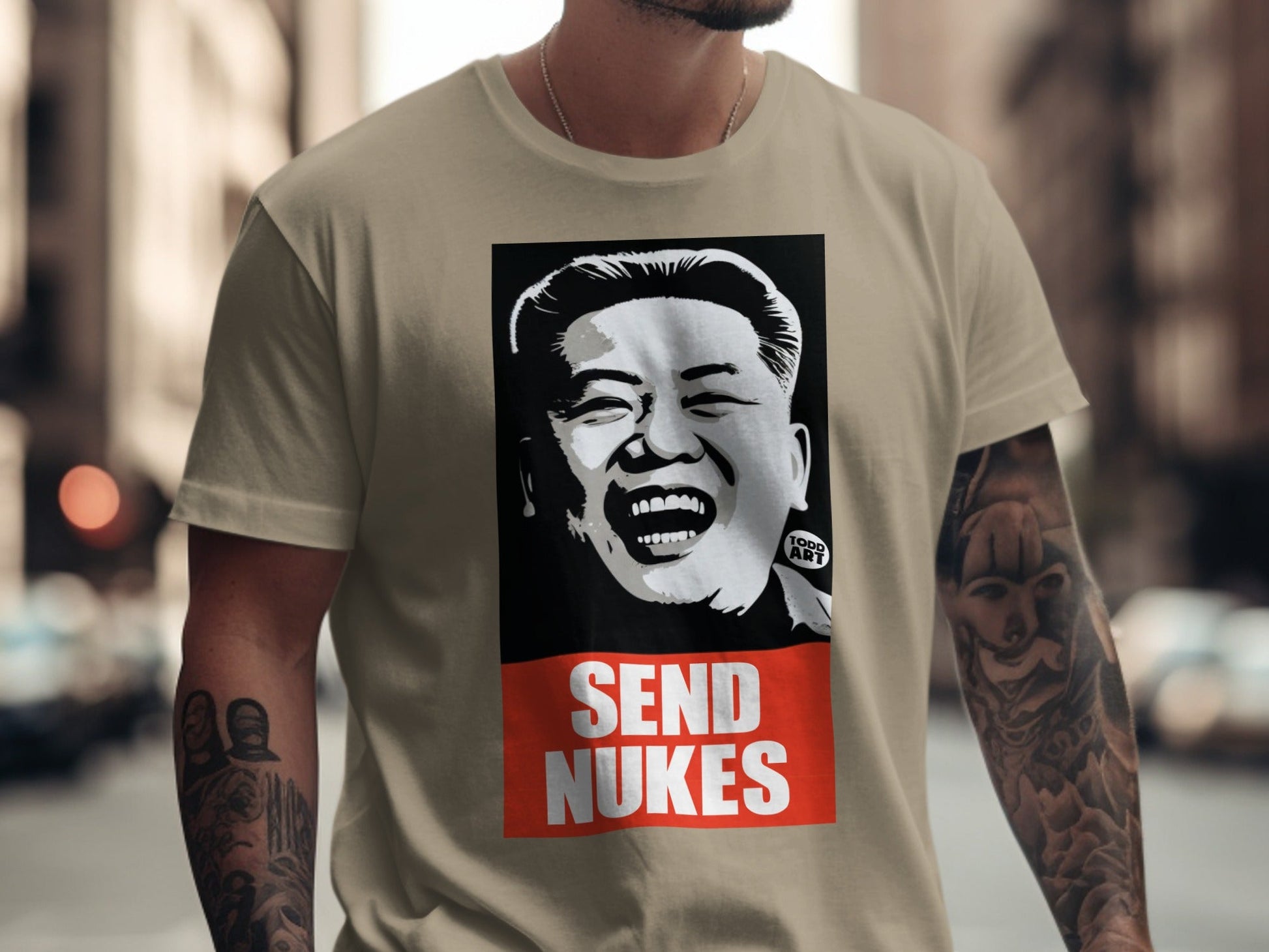 T-shirt with portrait of Kim Jong Un and "SEND NUKES" text.