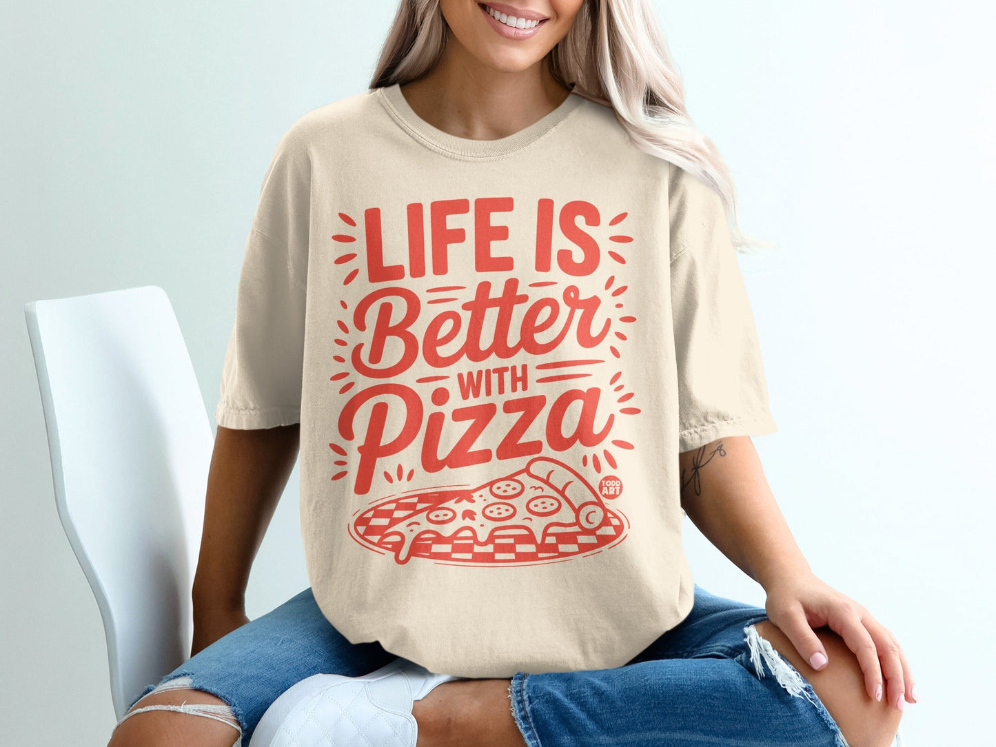 Cream t-shirt with "Life is Better with Pizza" text and pizza slice graphic.