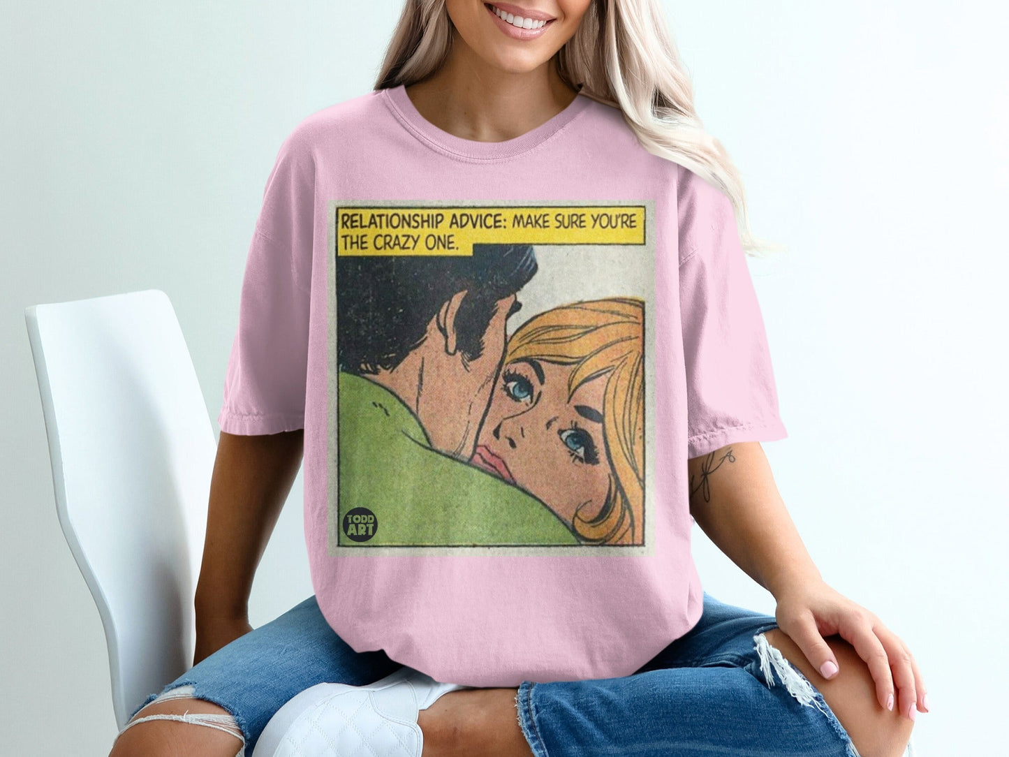 Pink t-shirt with comic art: "RELATIONSHIP ADVICE: MAKE SURE YOU'RE THE CRAZY ONE."