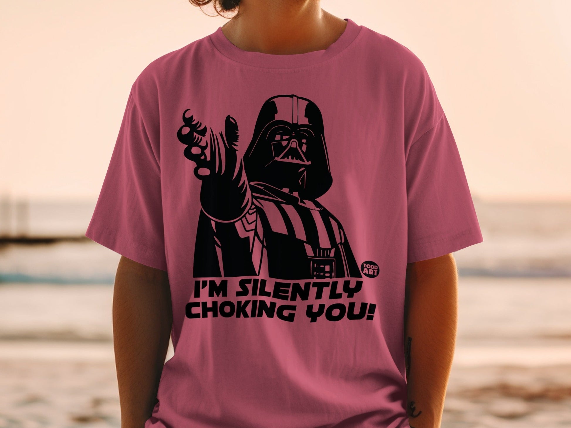 Darth Vader on a pink t-shirt with "I'm silently choking you!" text.