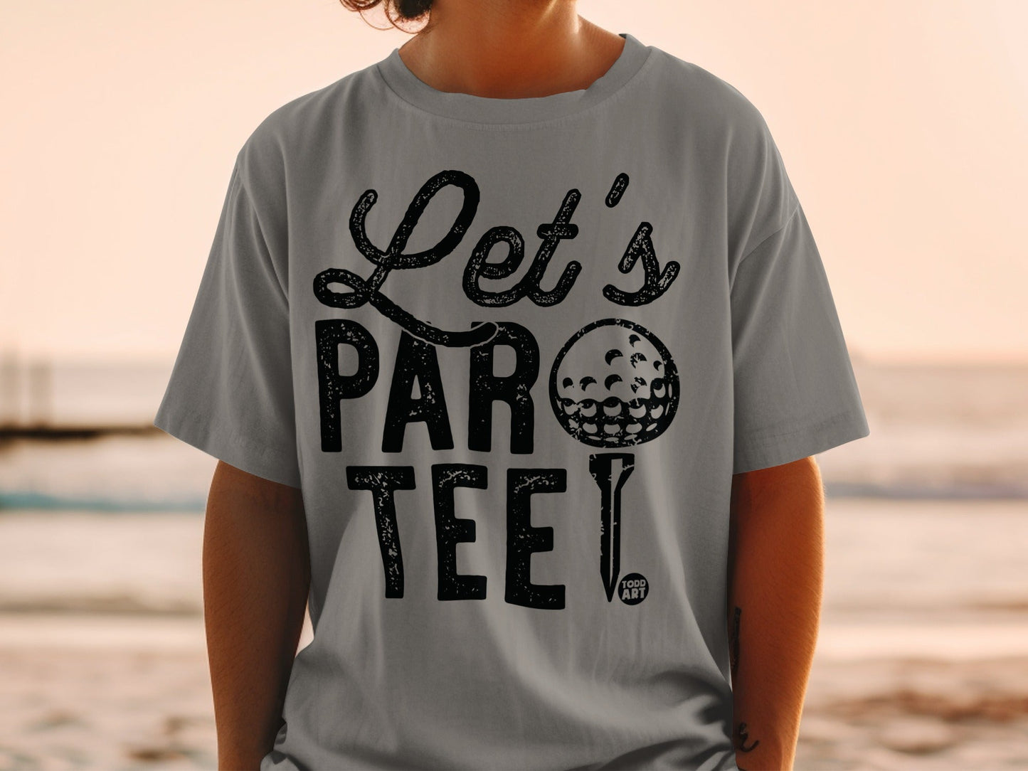 Grey t-shirt with "Let's Par Tee" text and a golf ball.