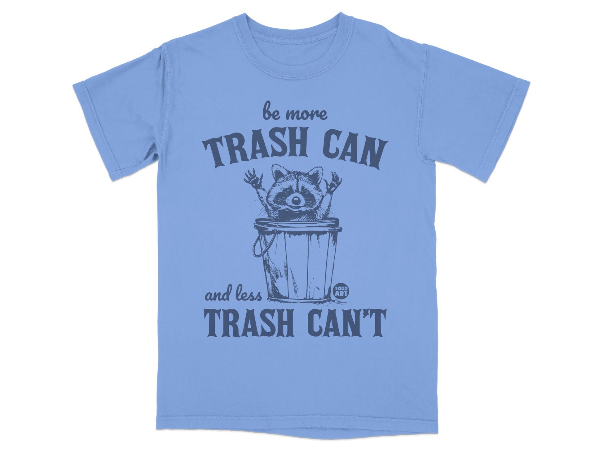 Blue t-shirt with raccoon in trash can saying "be more TRASH CAN and less TRASH CAN'T".