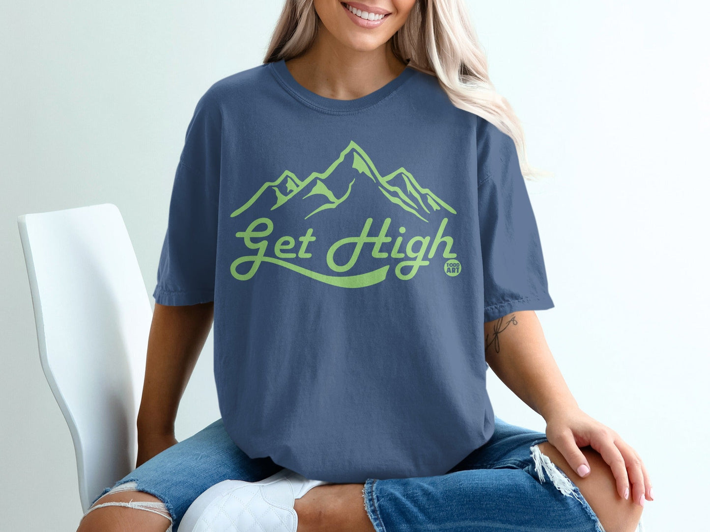 Blue t-shirt with "Get High" and mountain graphic.