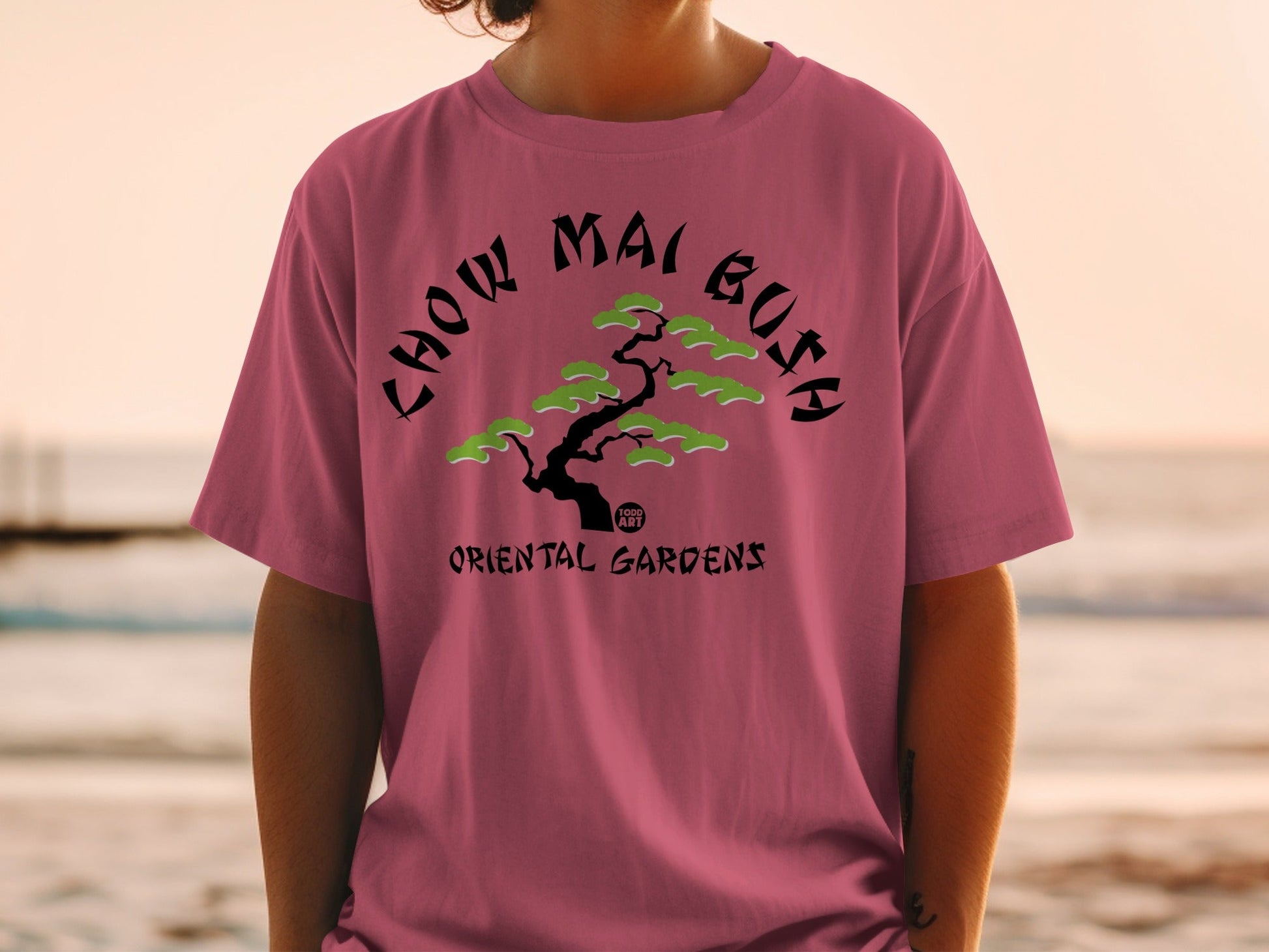 T-shirt with "Chow Mai Bush" and "Oriental Gardens" text and stylized tree.