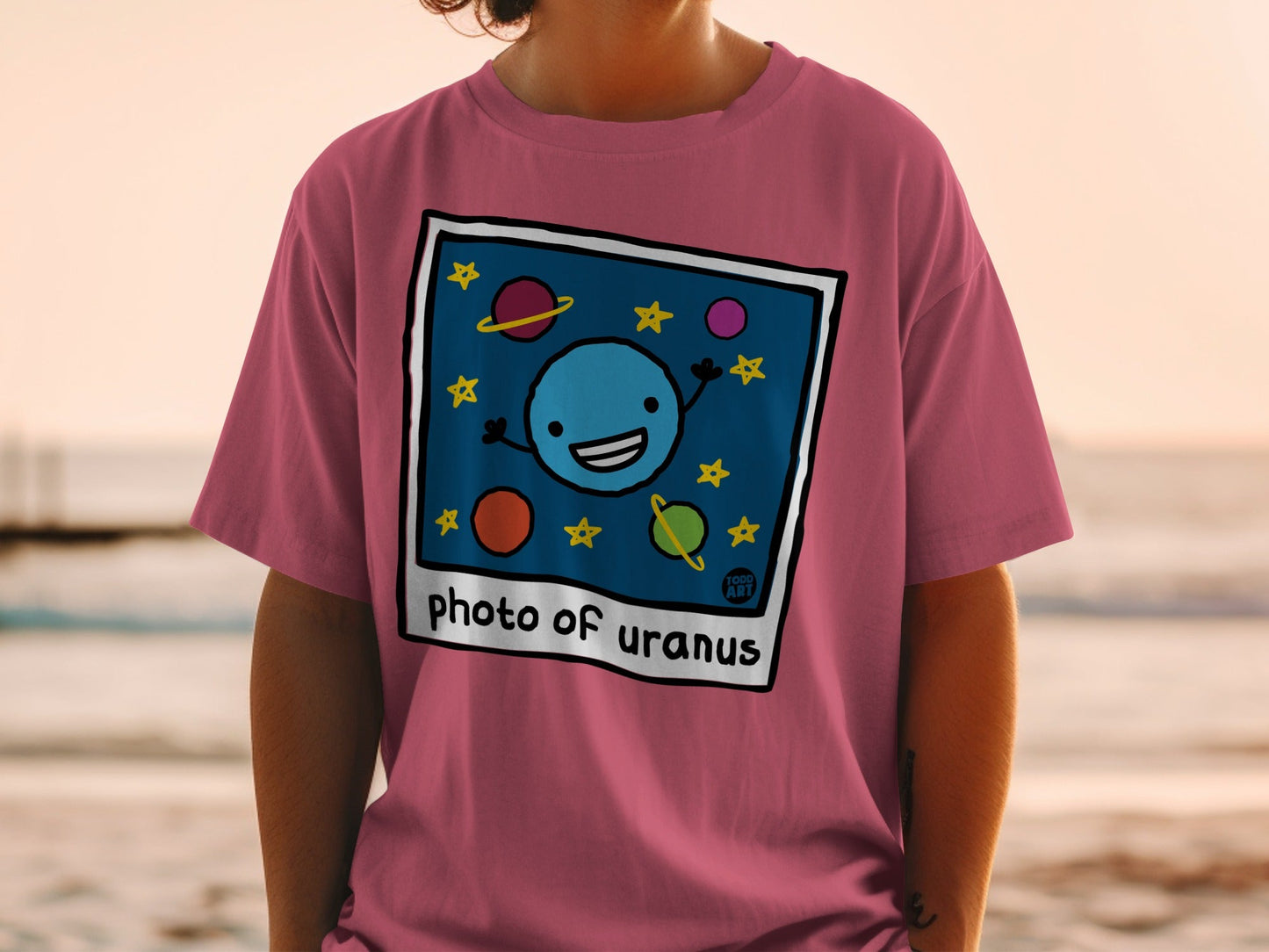 T-shirt with "Photo of Uranus" text and a cartoon planet and stars.