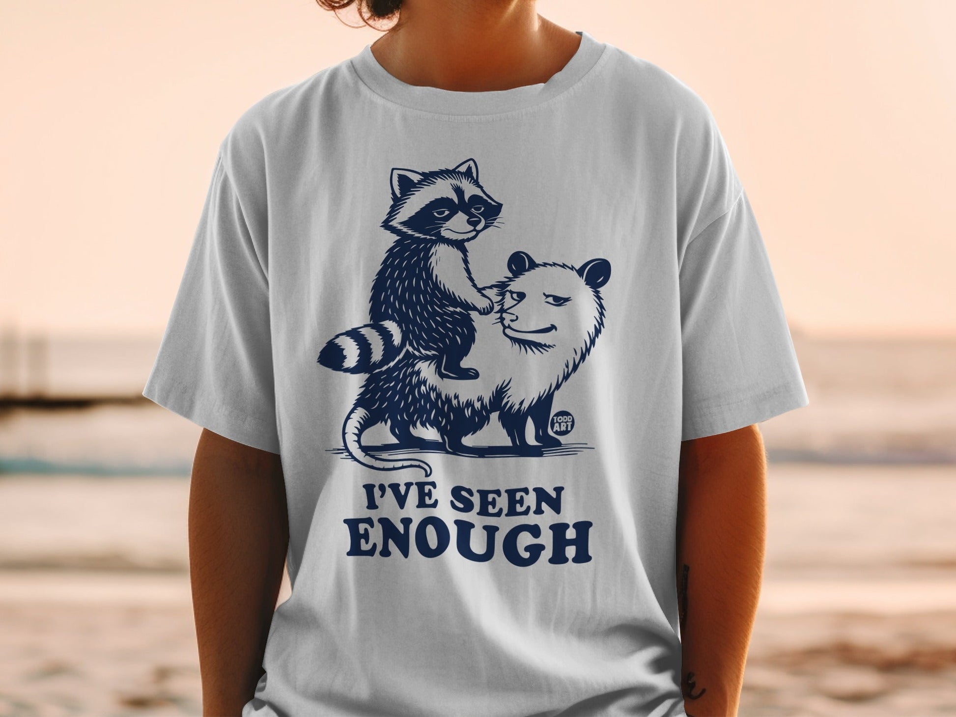 T-shirt with a raccoon riding an opossum, text "I'VE SEEN ENOUGH".