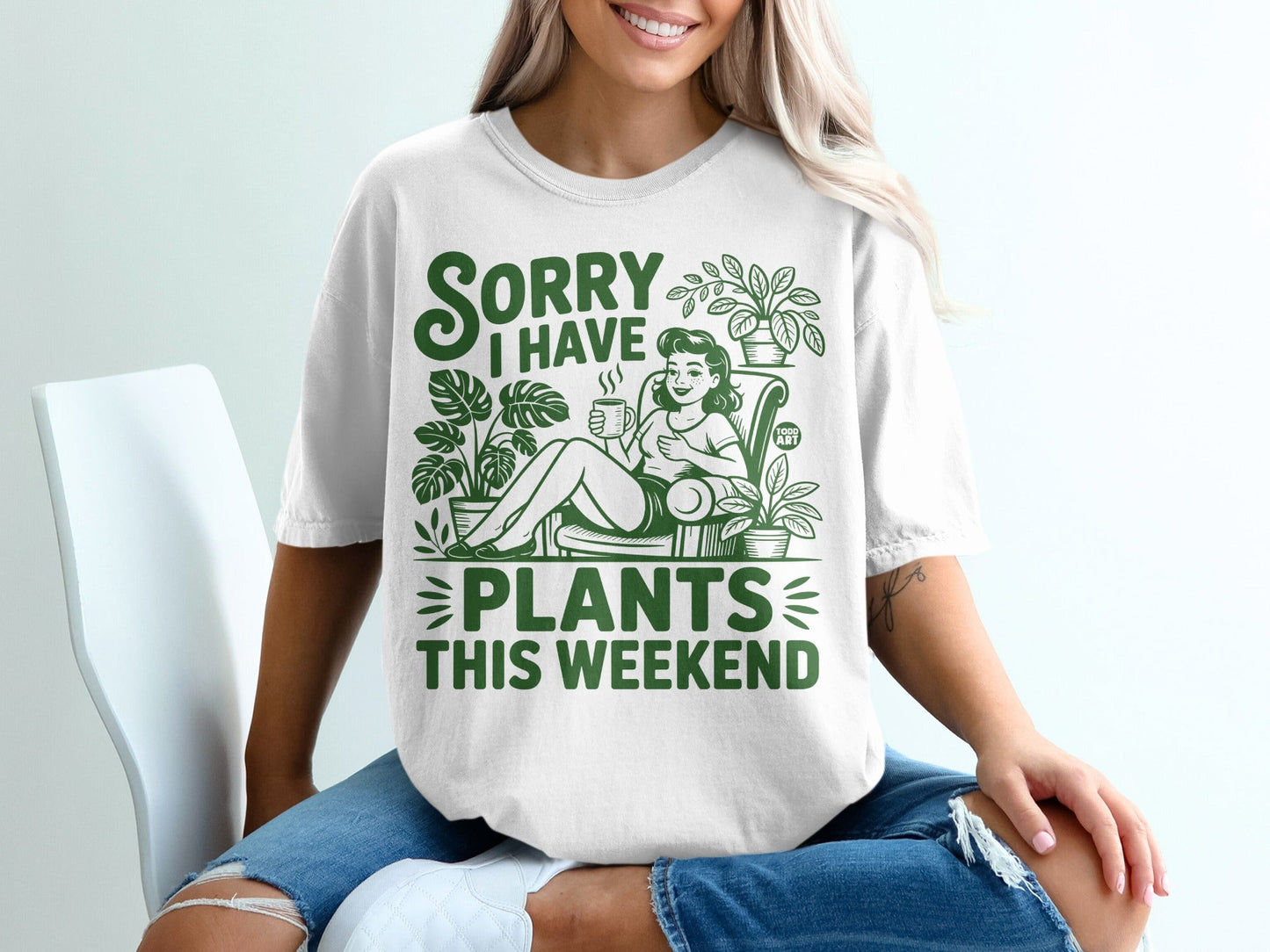 White t-shirt with "Sorry I Have Plants This Weekend" text and green plant illustrations.